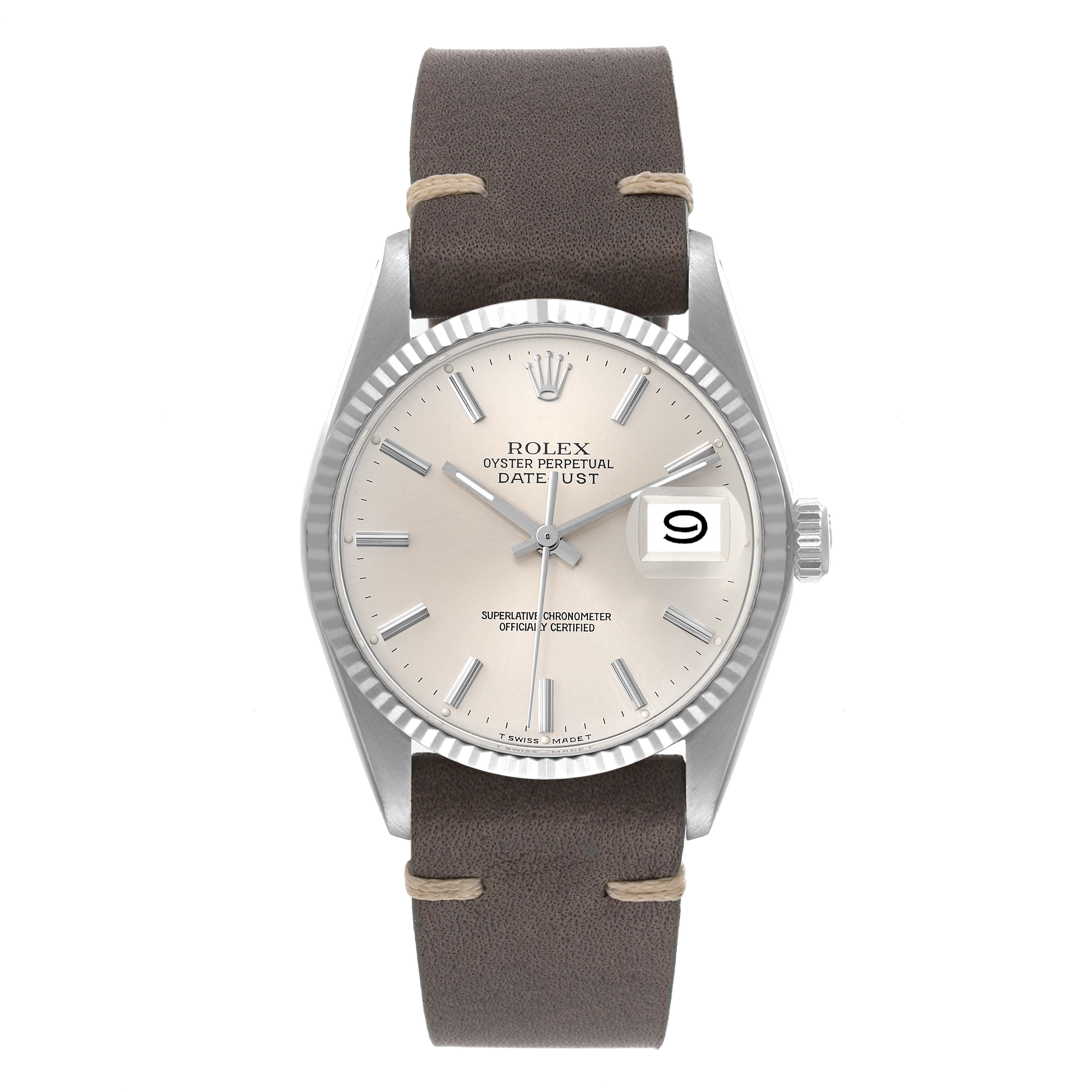 The Rolex Datejust 16014 Men's Steel and Gold (two tone) Silver Dial 16014 Men's Steel and Gold (two tone) Silver Dial is shown from a front angle, displaying its dial, bezel, and leather strap.