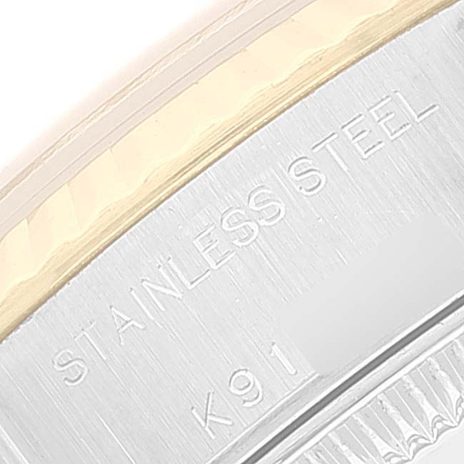 The image shows a close-up of the stainless steel section on the case back of a Rolex Datejust 79173 Women
s Steel and Gold (two tone) Black Dial 79173 Women
s Steel and Gold (two tone) Black Dial watch.