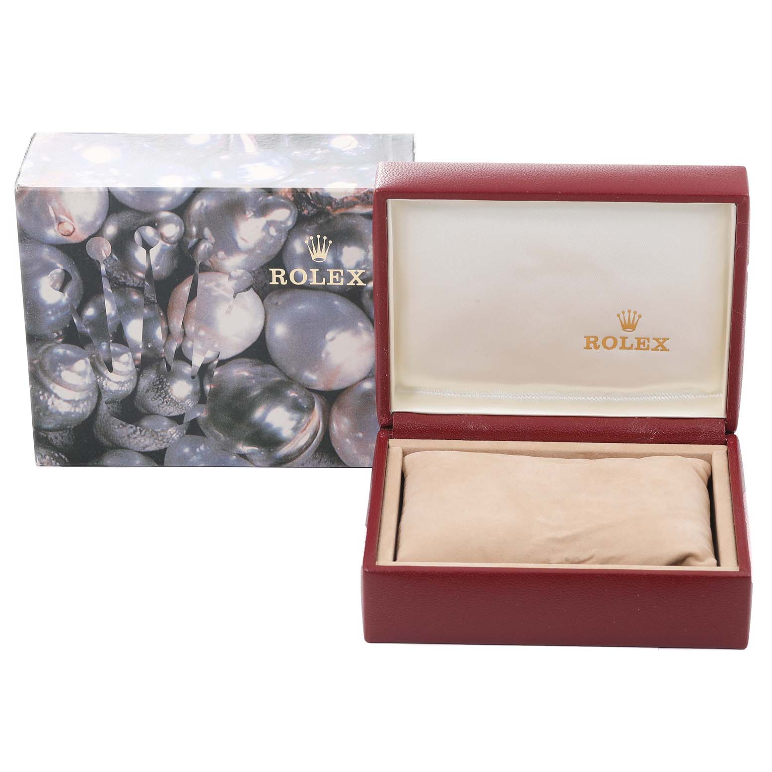 Image shows the Rolex Datejust 79173 Women
s Steel and Gold (two tone) Black Dial 79173 Women
s Steel and Gold (two tone) Black Dial watch box and outer packaging, open to reveal a pillow inside the burgundy case.