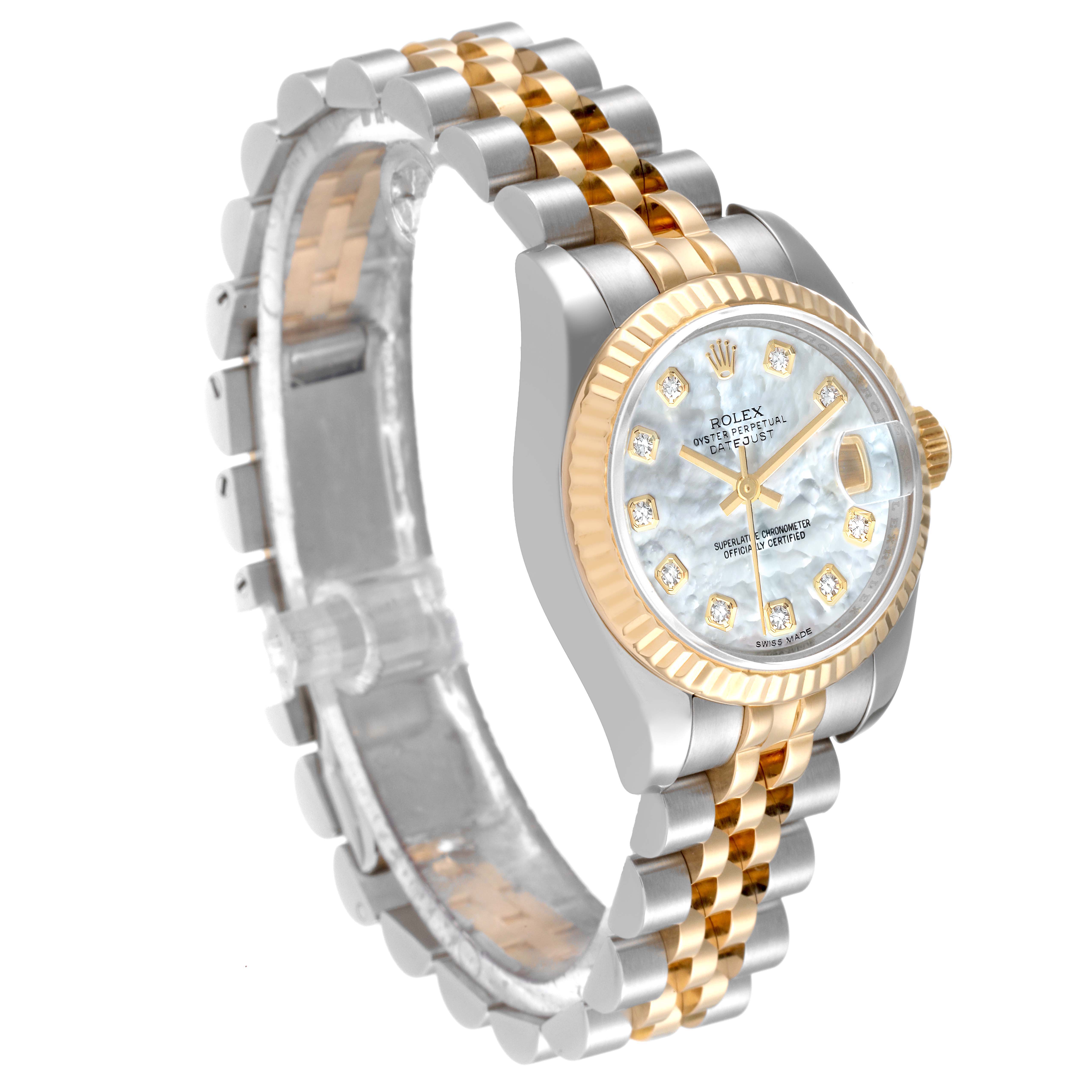 The Rolex Datejust 179173 Women's Steel and Gold (two tone) Mother of Pearl Dial 179173 Women's Steel and Gold (two tone) Mother of Pearl Dial watch is shown from an angled side view, highlighting its two-tone bracelet, fluted bezel, and diamond hour markers.
