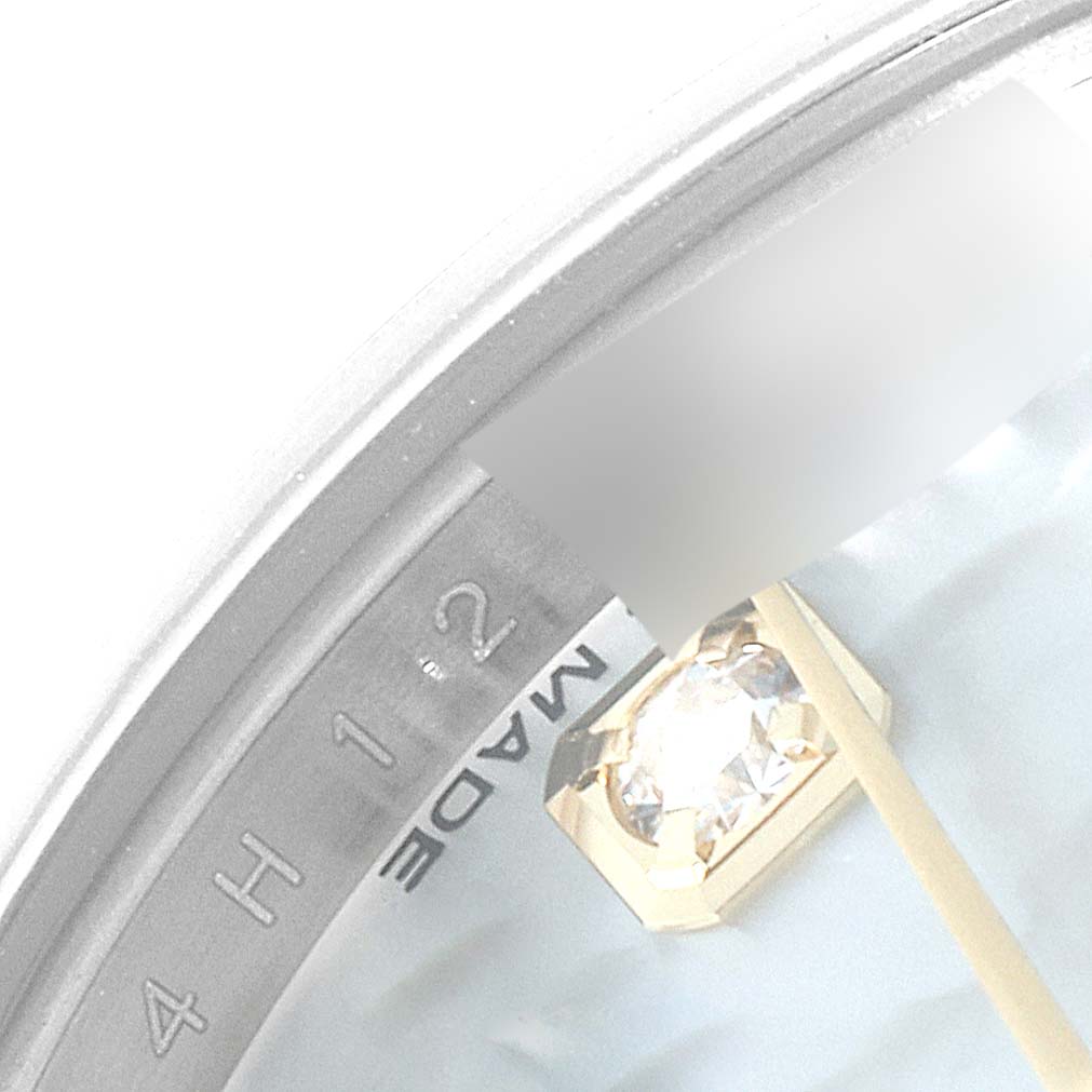 The image shows a close-up of the dial of a Rolex Datejust 179173 Women's Steel and Gold (two tone) Mother of Pearl Dial 179173 Women's Steel and Gold (two tone) Mother of Pearl Dial, focusing on the periphery, including a diamond marker and "SWISS MADE" text.