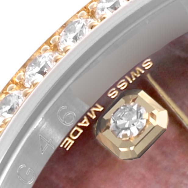 The image shows an angled close-up of the bezel and part of the dial of a Rolex Datejust 116243 Men's Steel and Gold (two tone) Mother of Pearl Dial 116243 Men's Steel and Gold (two tone) Mother of Pearl Dial, highlighting diamonds and “Swiss Made.”