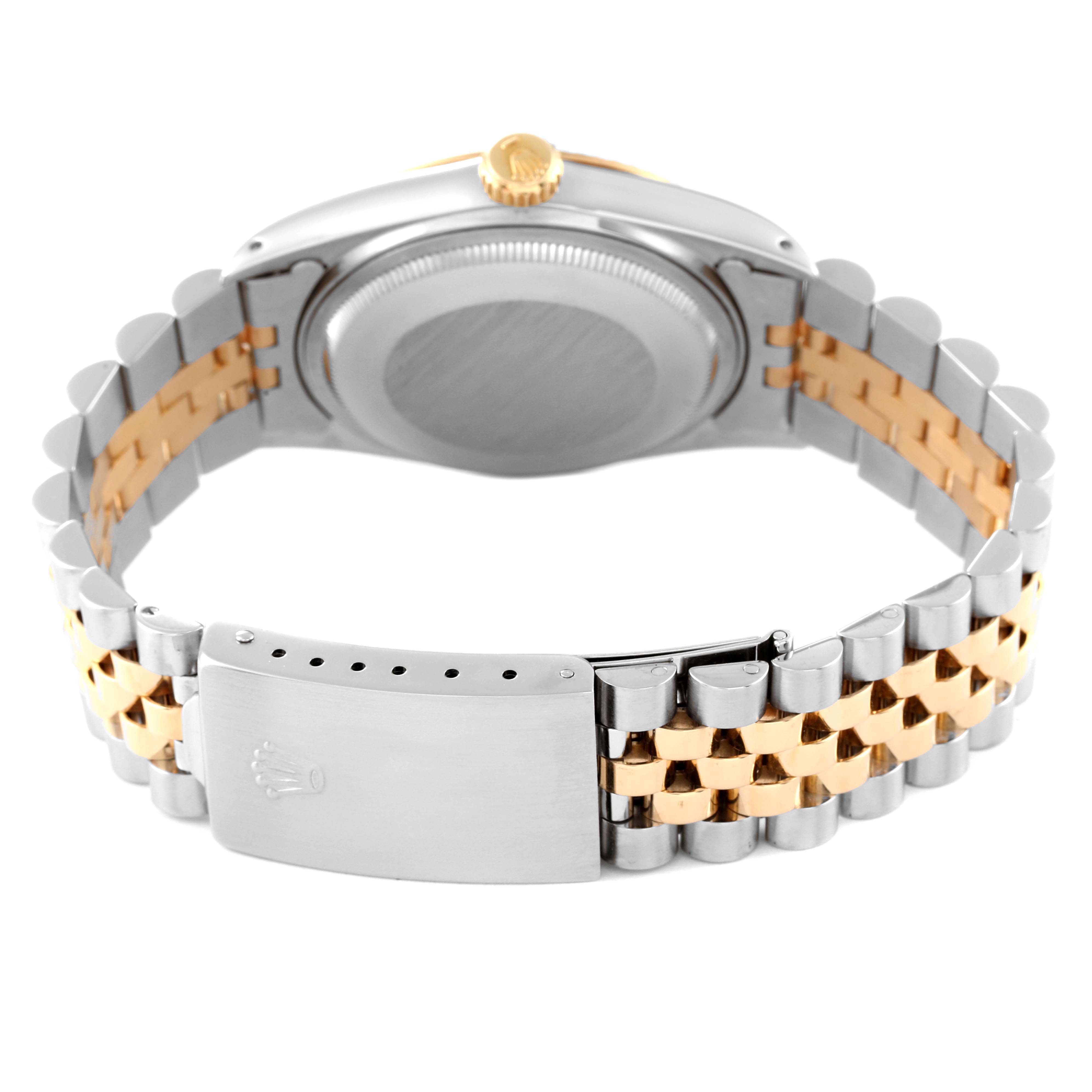 The image shows the back view of a Rolex Datejust 16013 Men's Steel and Gold (two tone) Beige Dial 16013 Men's Steel and Gold (two tone) Beige Dial watch, highlighting its two-tone bracelet and clasp.
