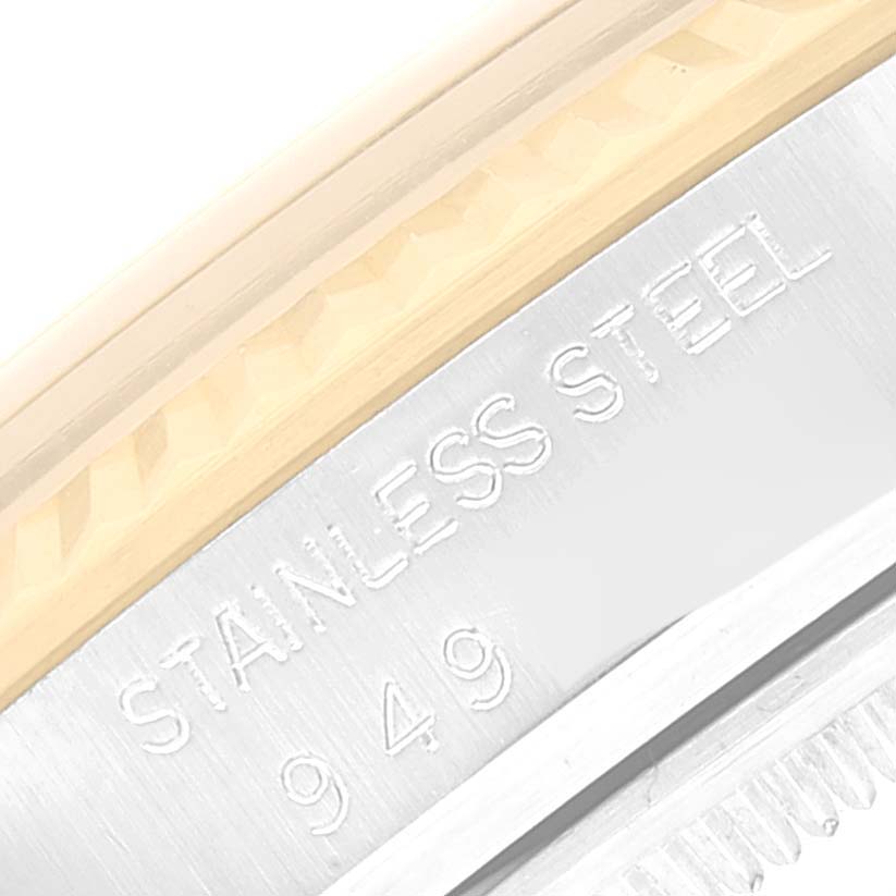 This image shows a close-up of the case side of a Rolex Datejust 16013 Men's Steel and Gold (two tone) Beige Dial 16013 Men's Steel and Gold (two tone) Beige Dial watch, highlighting the "STAINLESS STEEL" engraving.