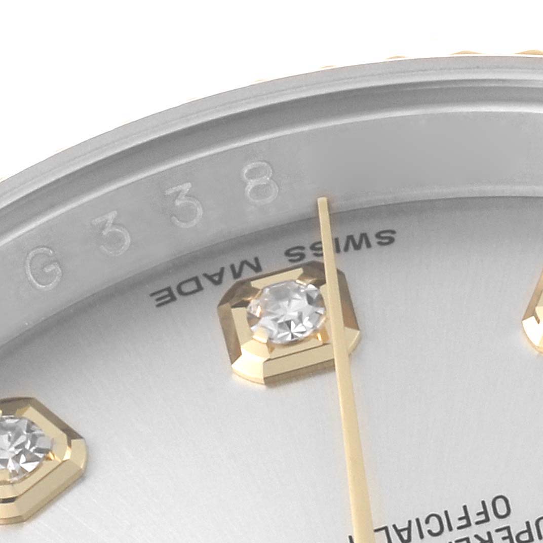This close-up of a Datejust model Rolex watch shows part of the dial, a diamond marker, and the second hand.