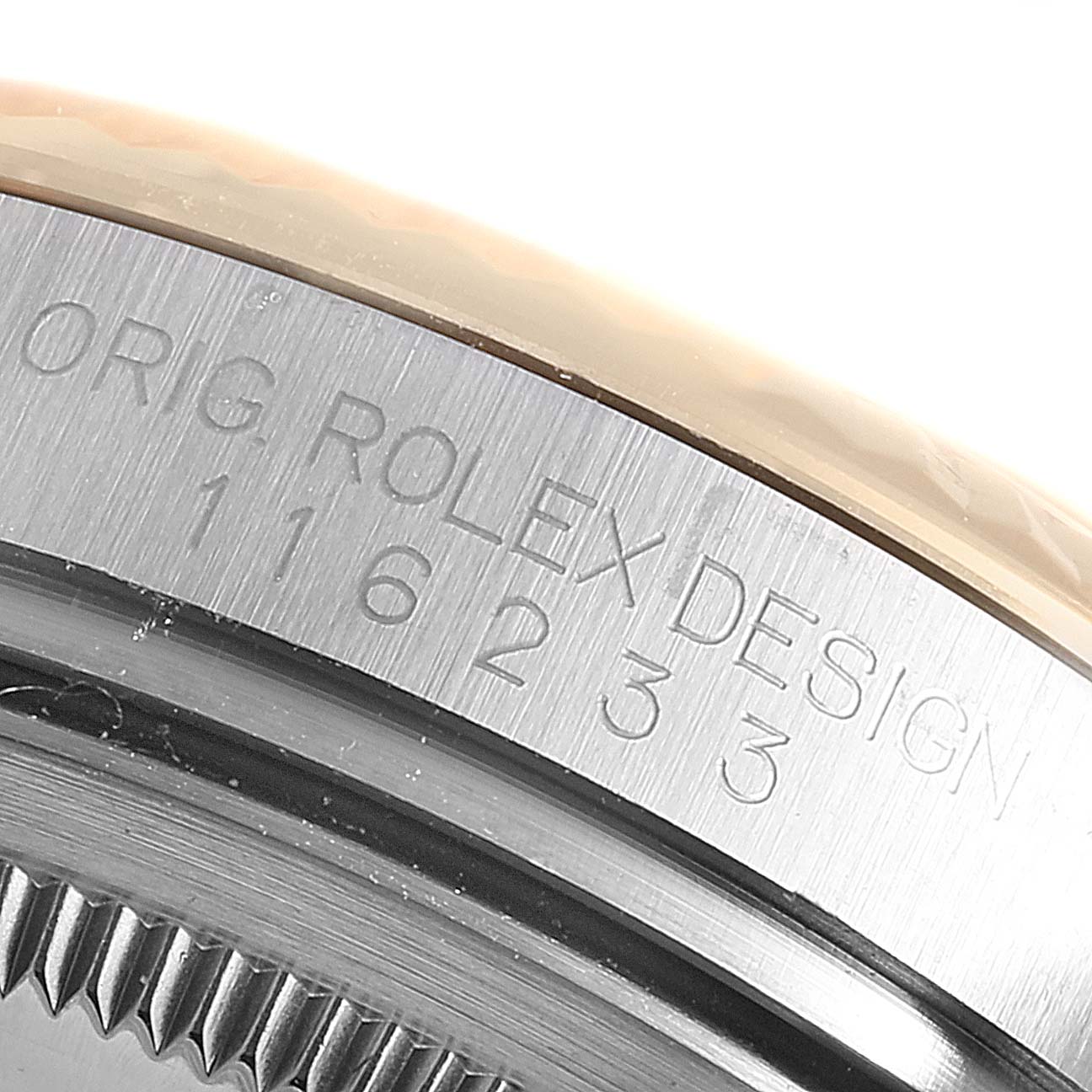 The image shows the engraved serial number and model details on the case edge of a Rolex Datejust 116233 Men's Steel and Gold (two tone) Silver Dial 116233 Men's Steel and Gold (two tone) Silver Dial watch.