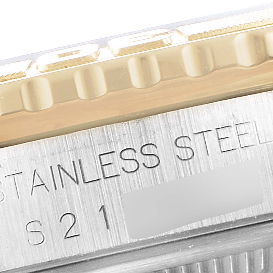 The image shows a close-up of the bezel and part of the case of a Rolex Turn-o-Graph 16263 Men
s Steel and Gold (two tone) Champagne Dial 16263 Men
s Steel and Gold (two tone) Champagne Dial watch, highlighting its stainless steel material.