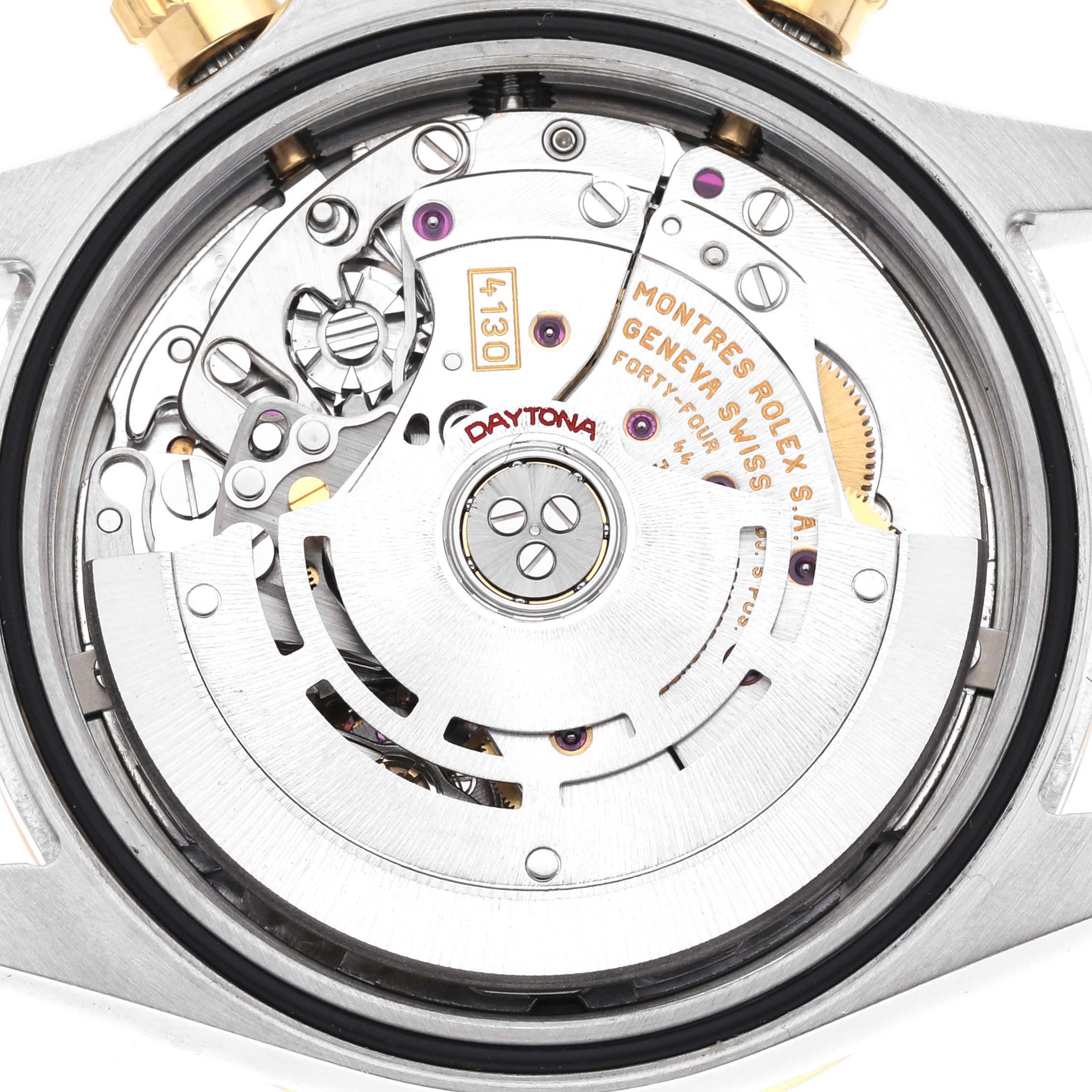 The image shows the movement and rotor from the back of a Rolex Daytona 116523 Men's Steel and Gold (two tone) Black Dial 116523 Men's Steel and Gold (two tone) Black Dial watch, highlighting the intricate details.