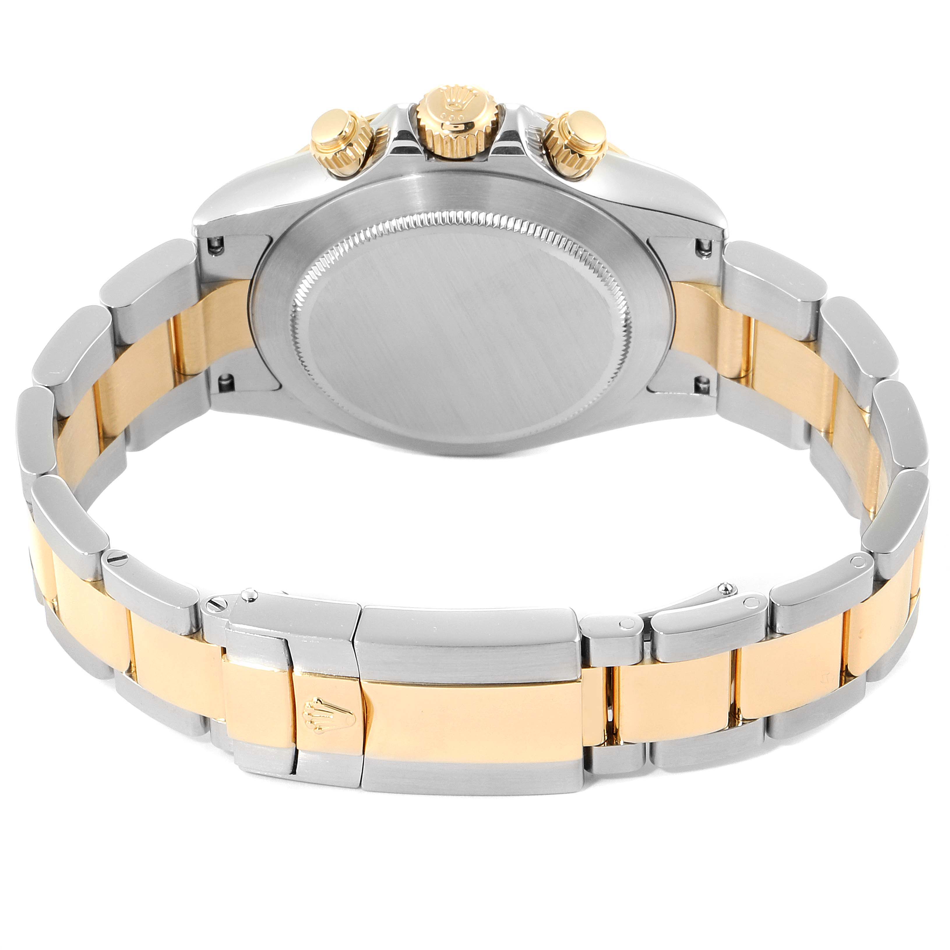 The image shows the back and sides of a Rolex Daytona 16523 Men's Steel and Gold (two tone) Grey Dial 16523 Men's Steel and Gold (two tone) Grey Dial watch, highlighting its bracelet and crown.