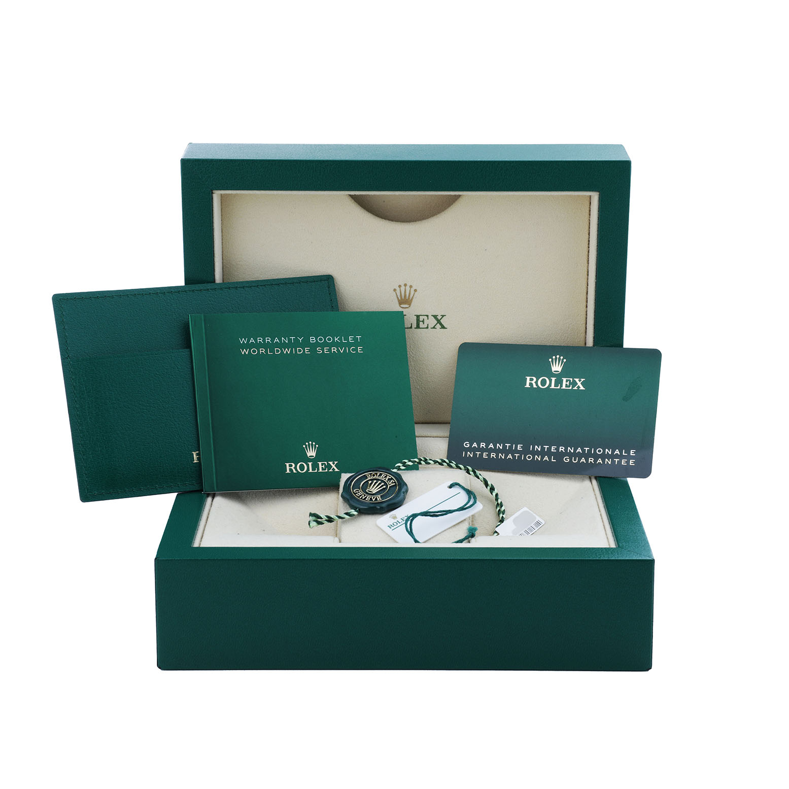 This image shows the packaging and accessories for the Rolex Explorer 216570 Men's Stainless Steel Black Dial, including booklets, a guarantee card, and tags.