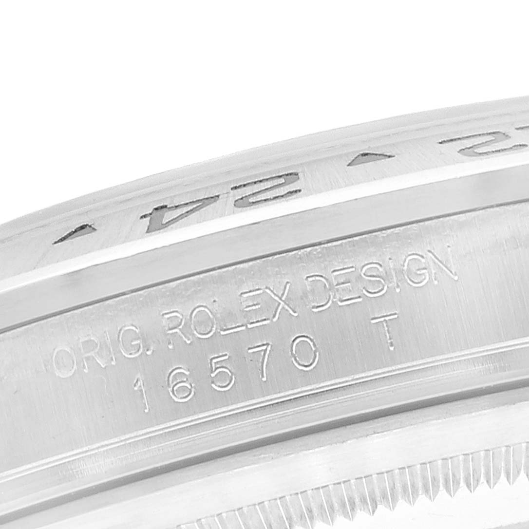 Close-up of the side of a Rolex Explorer 16570 Men
s Stainless Steel Black Dial 16570 Men
s Stainless Steel Black Dial model watch, showing the engraved design and model number 16570.