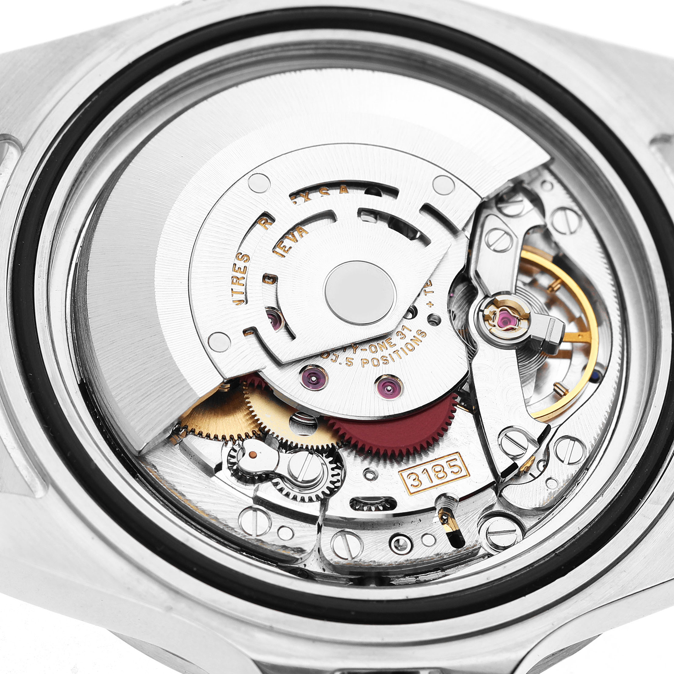 The image shows the back view of a Rolex Explorer 16570 Men's Stainless Steel White Dial movement, revealing gears and intricate components.