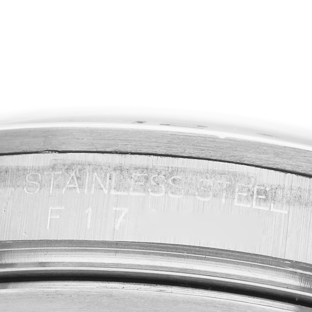 The image shows a close-up of the side of a Rolex Explorer 16570 Men's Stainless Steel White Dial's stainless steel casing, highlighting the engraved text.