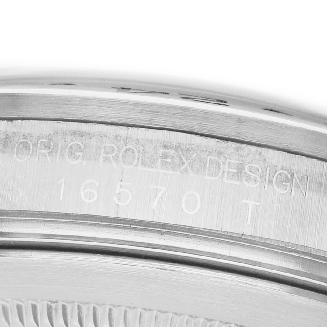The image shows a close-up of the side of a Rolex Explorer 16570 Men's Stainless Steel White Dial watch, displaying the engraved design and model number.
