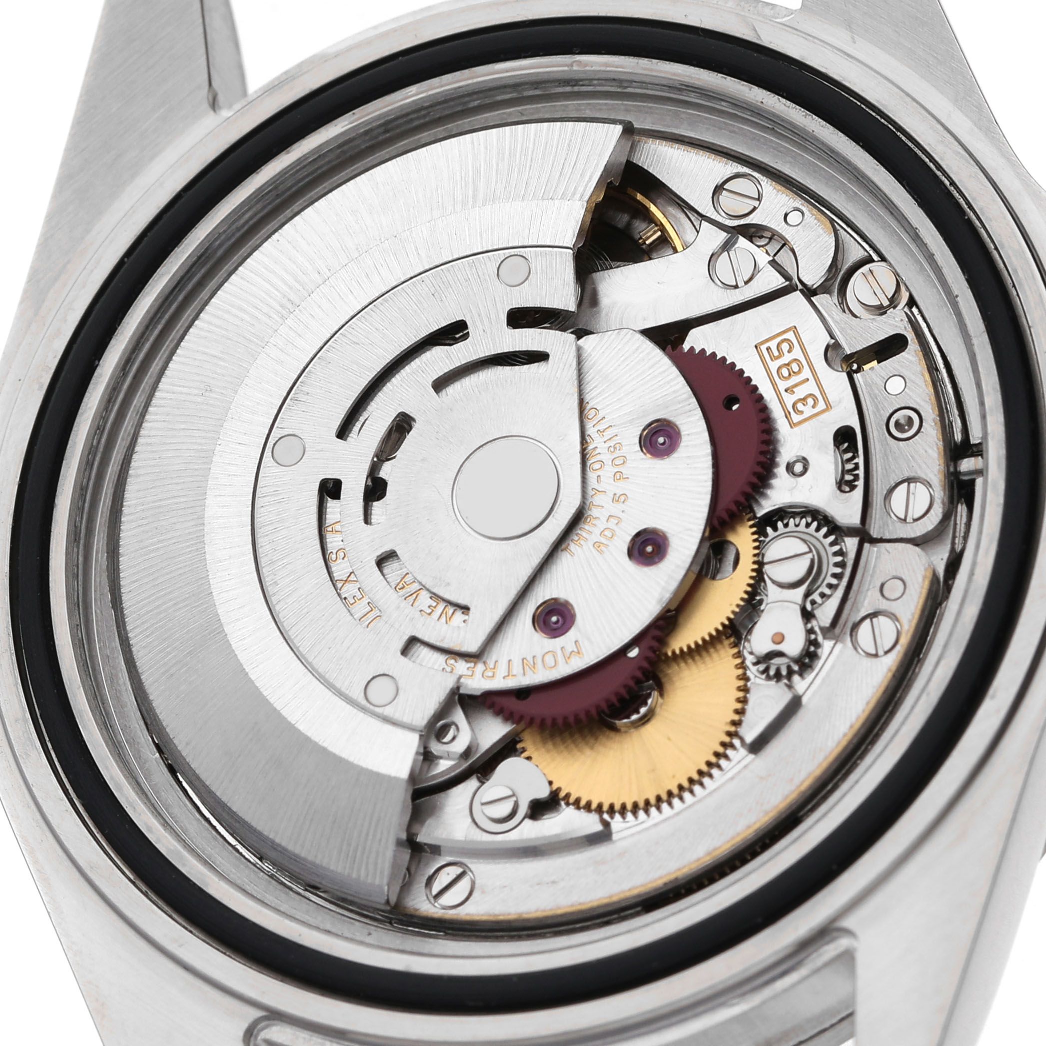 The image shows the movement of a Rolex Explorer 16570 Men's Stainless Steel White Dial watch from a top-down angle, highlighting gears and the oscillating weight.