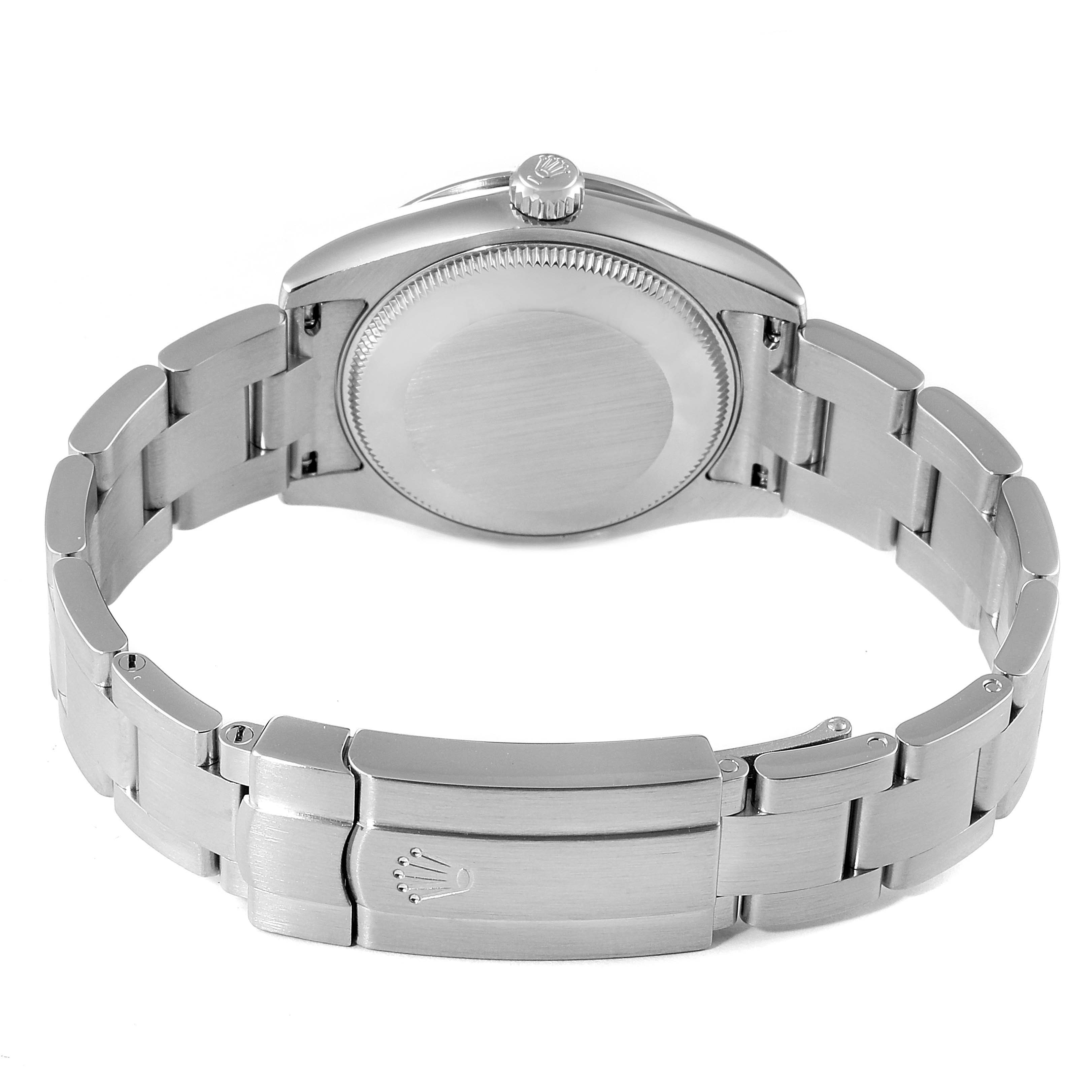 The image shows the back case and bracelet clasp of a Mid-Size Rolex watch from a rear angle.