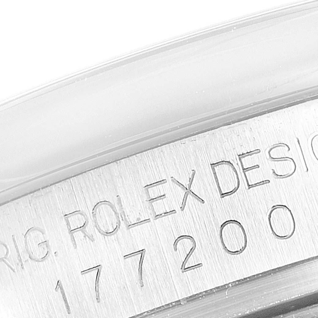 The image shows a close-up of the serial number engraving on the side of a Rolex Mid-Size 177200 Women
s Stainless Steel Black Dial 177200 Women
s Stainless Steel Black Dial watch case.