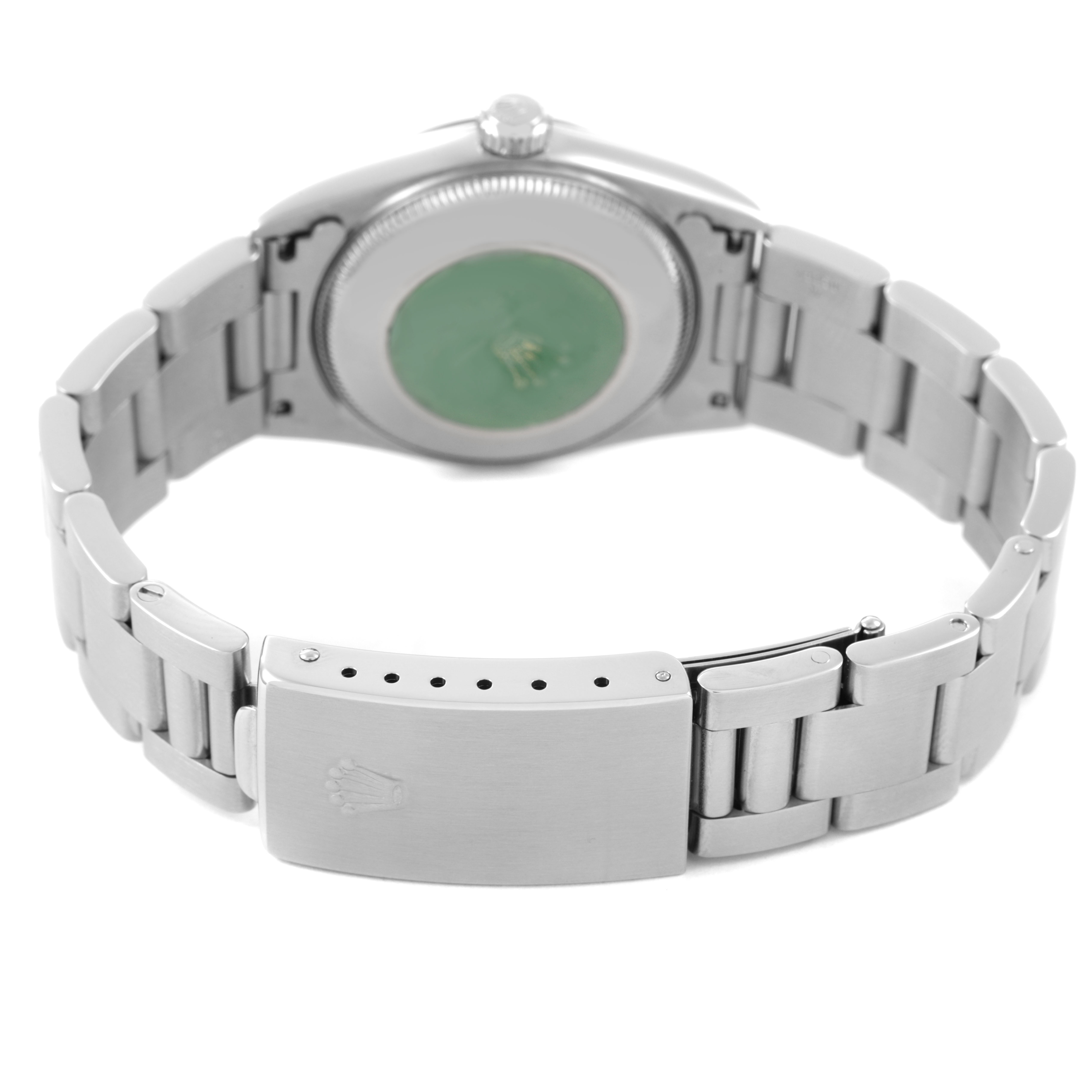 The Rolex Oyster Perpetual 77080 Women's Stainless Steel Pink Dial watch is shown from the rear, highlighting the bracelet and clasp.