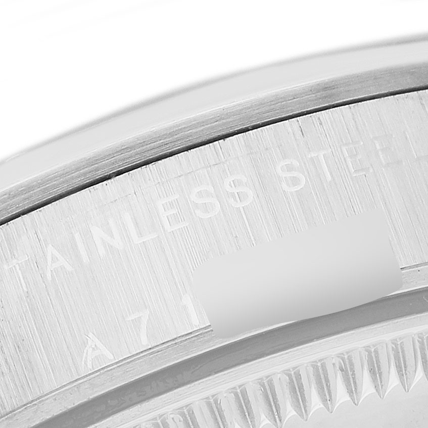 This close-up image shows the edge of the bezel and engraved details of a Rolex Oyster Perpetual 77080 Women's Stainless Steel Pink Dial watch.