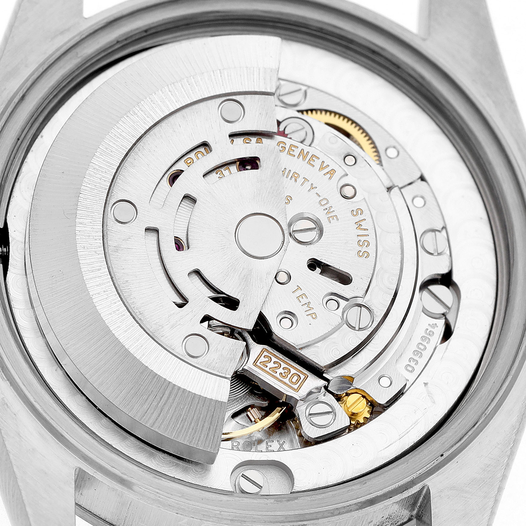 The image shows a detailed view of the movement inside a Rolex Oyster Perpetual 77080 Women's Stainless Steel Pink Dial watch, focusing on the rotor and gears.