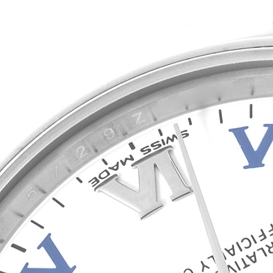 This image shows a partial view of a Rolex Mid-Size 177200 Women
s Stainless Steel White Dial 177200 Women
s Stainless Steel White Dial watch, featuring the edge of the dial, Roman numerals, and the "SWISS MADE" marking.