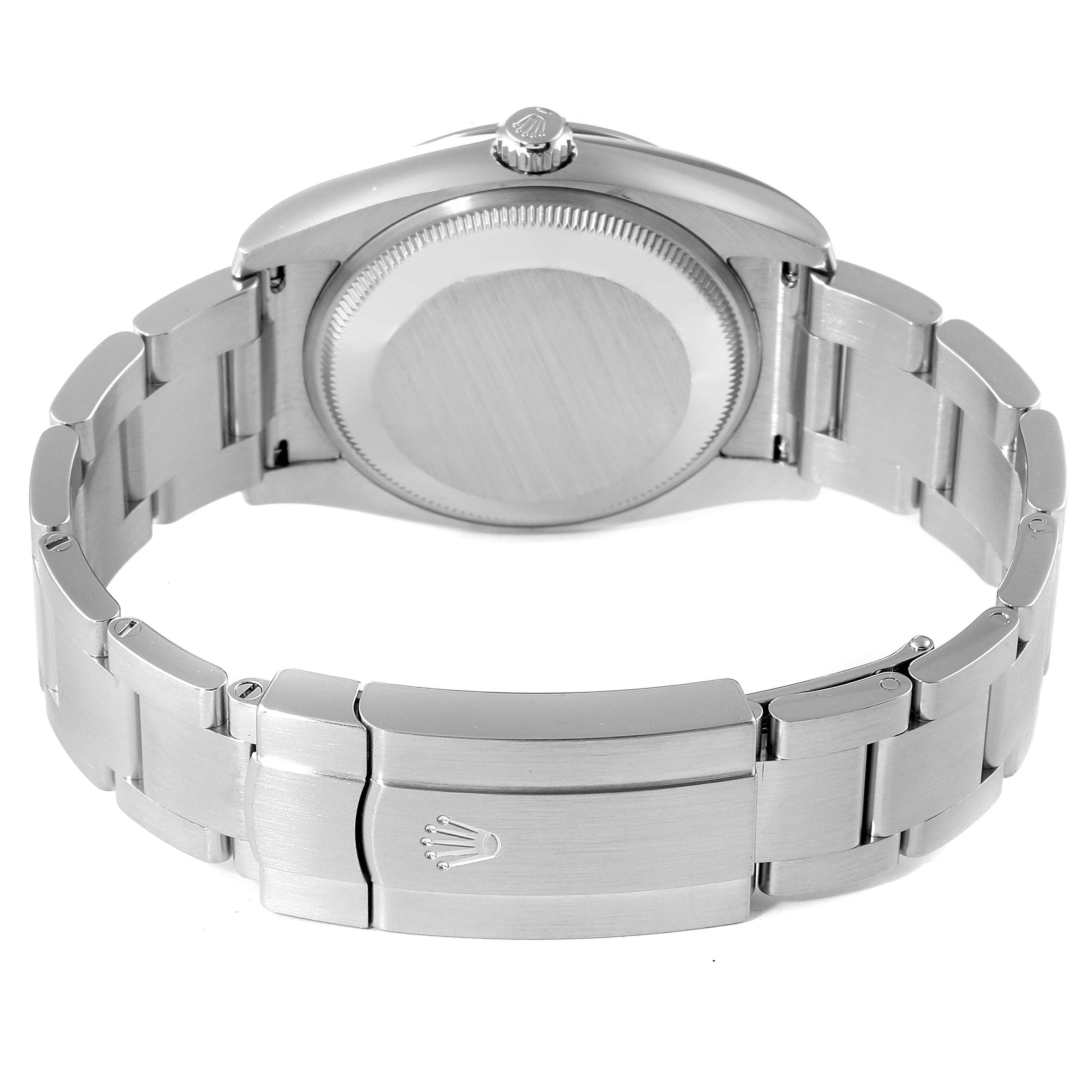 The image shows the back view of a Rolex Oyster Perpetual 114200 Men
s Stainless Steel Green Dial 114200 Men
s Stainless Steel Green Dial watch, highlighting the bracelet and clasp.