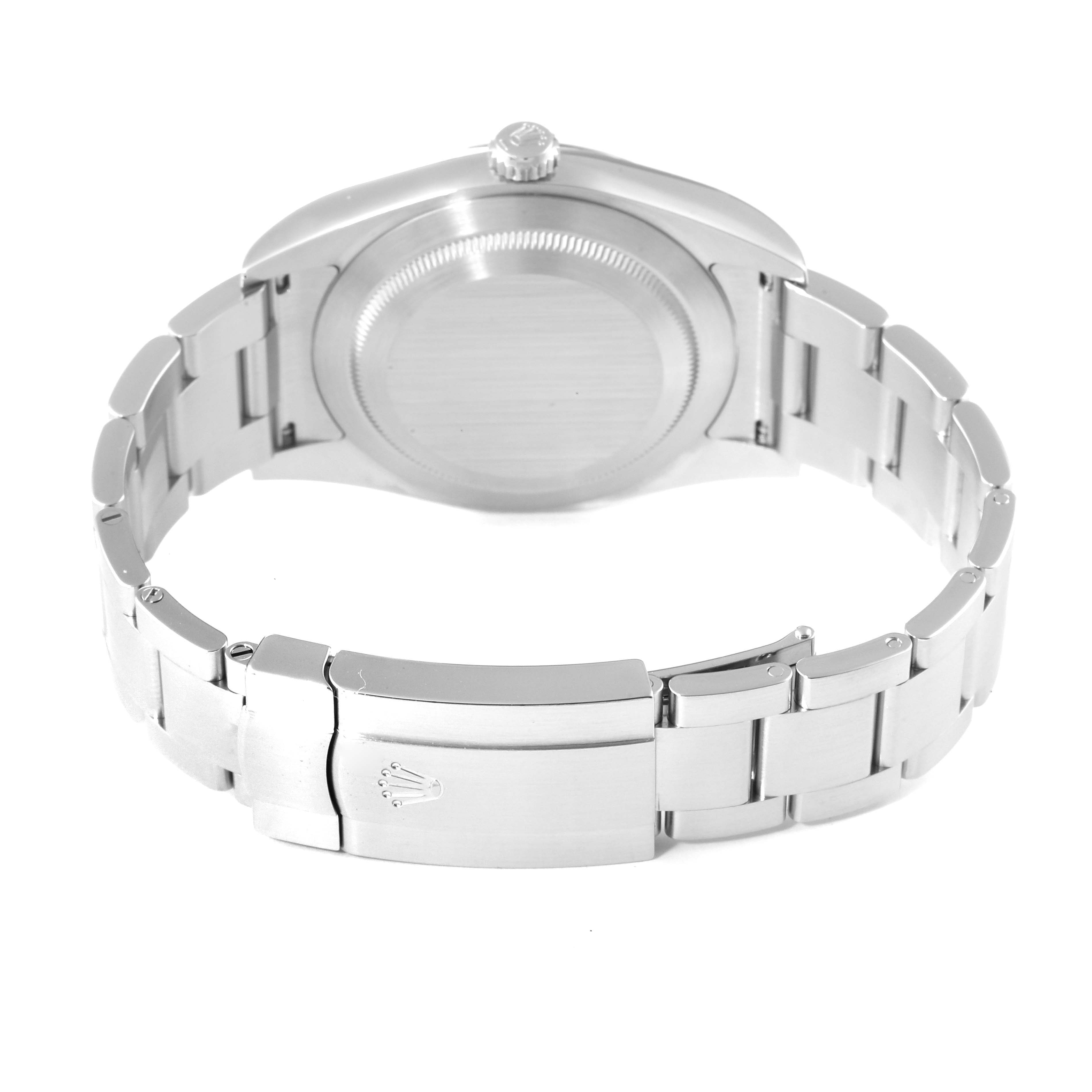 The image shows a Rolex Oyster Perpetual 114300 Men
s Stainless Steel Blue Dial 114300 Men
s Stainless Steel Blue Dial watch photographed from the back side, highlighting the bracelet and clasp.