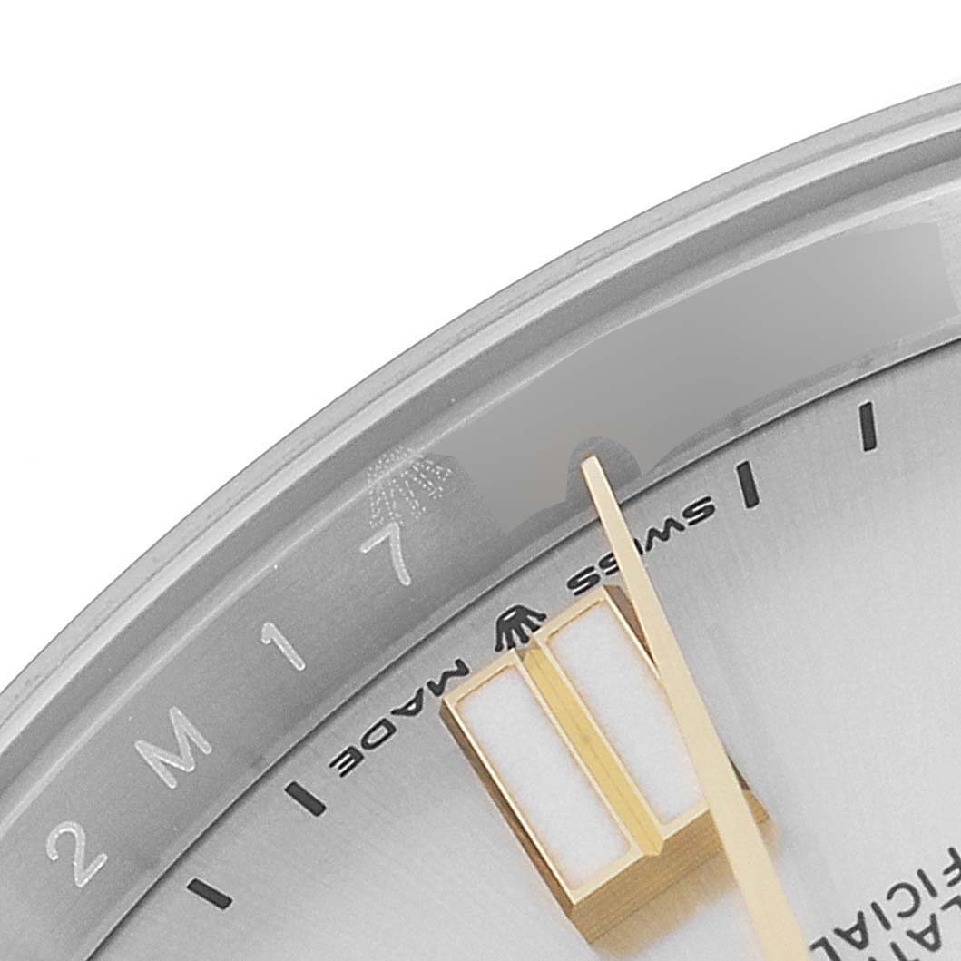 The image shows a close-up of the dial and bezel of the Rolex Oyster Perpetual 124300 Men's Stainless Steel Silver Dial 124300 Men's Stainless Steel Silver Dial watch, featuring the hour markers and part of the minute hand.