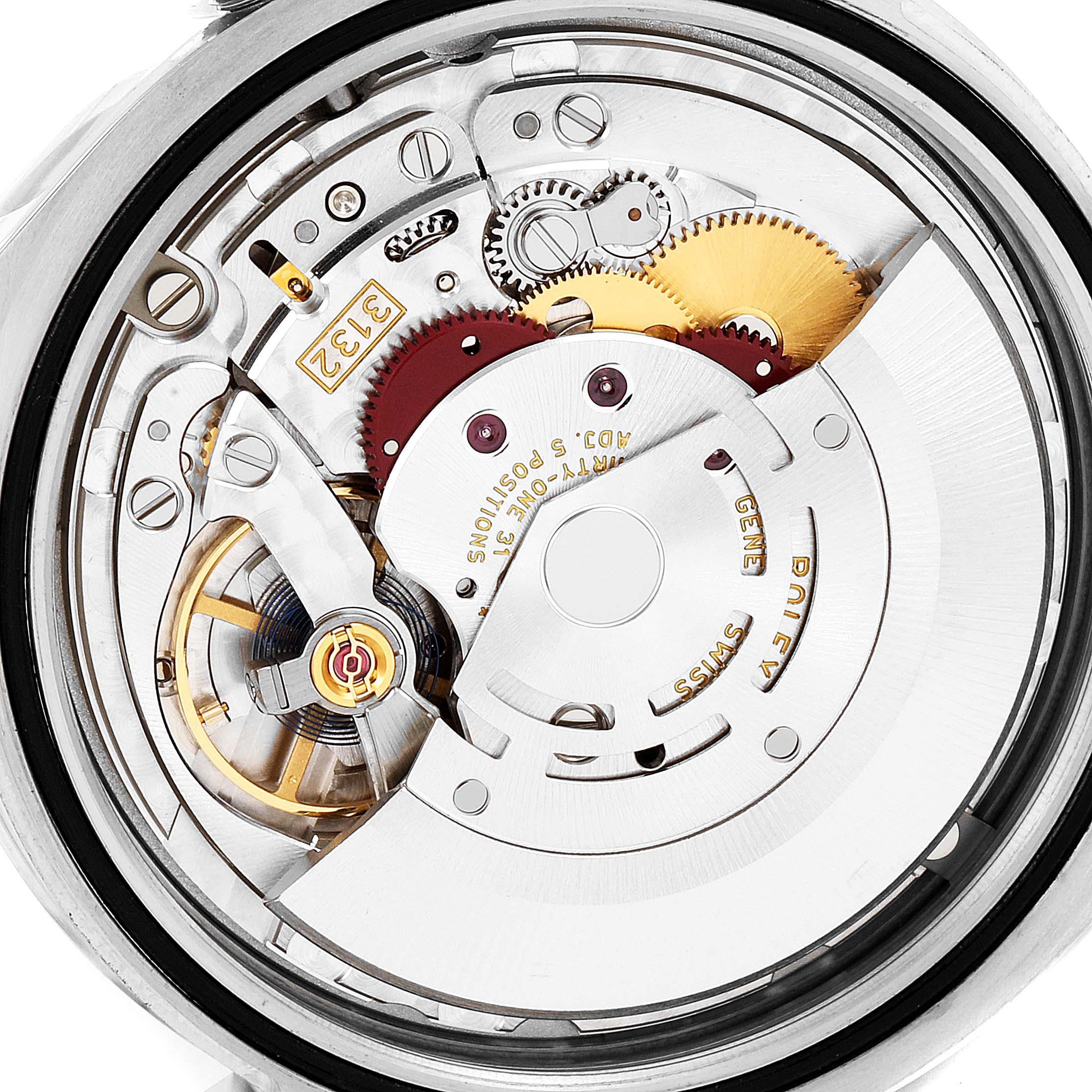 This image shows the intricate inner mechanism and movement parts of a Rolex Oyster Perpetual 114300 Men's Stainless Steel Burgundy Dial 114300 Men's Stainless Steel Burgundy Dial watch.