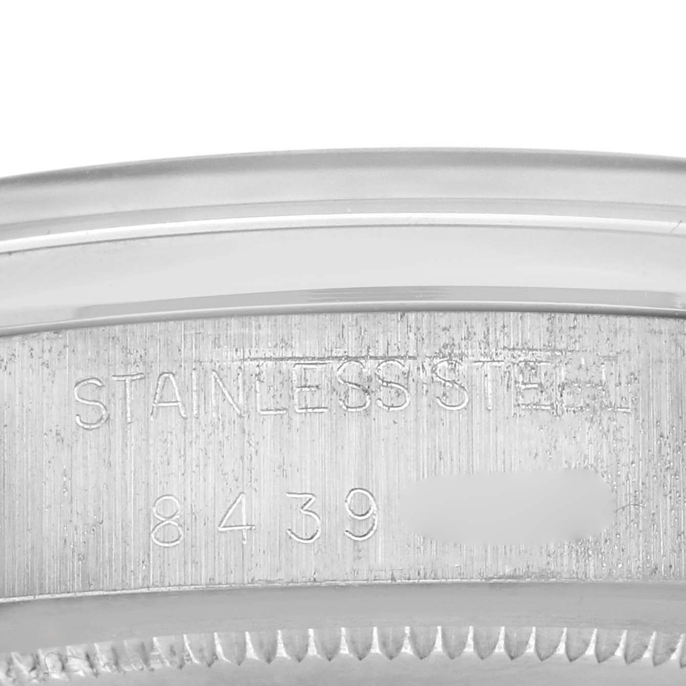 The image shows the side of a Rolex Vintage Collection 6694 Men's Stainless Steel Silver Dial 6694 Men's Stainless Steel Silver Dial watch case with the serial number engraved.