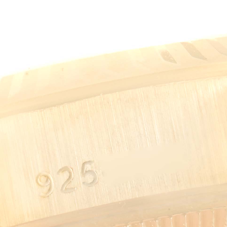 The image shows a close-up of the side engraving on a Rolex President 69178 Women's Yellow Gold Champagne Dial 69178 Women's Yellow Gold Champagne Dial watch.