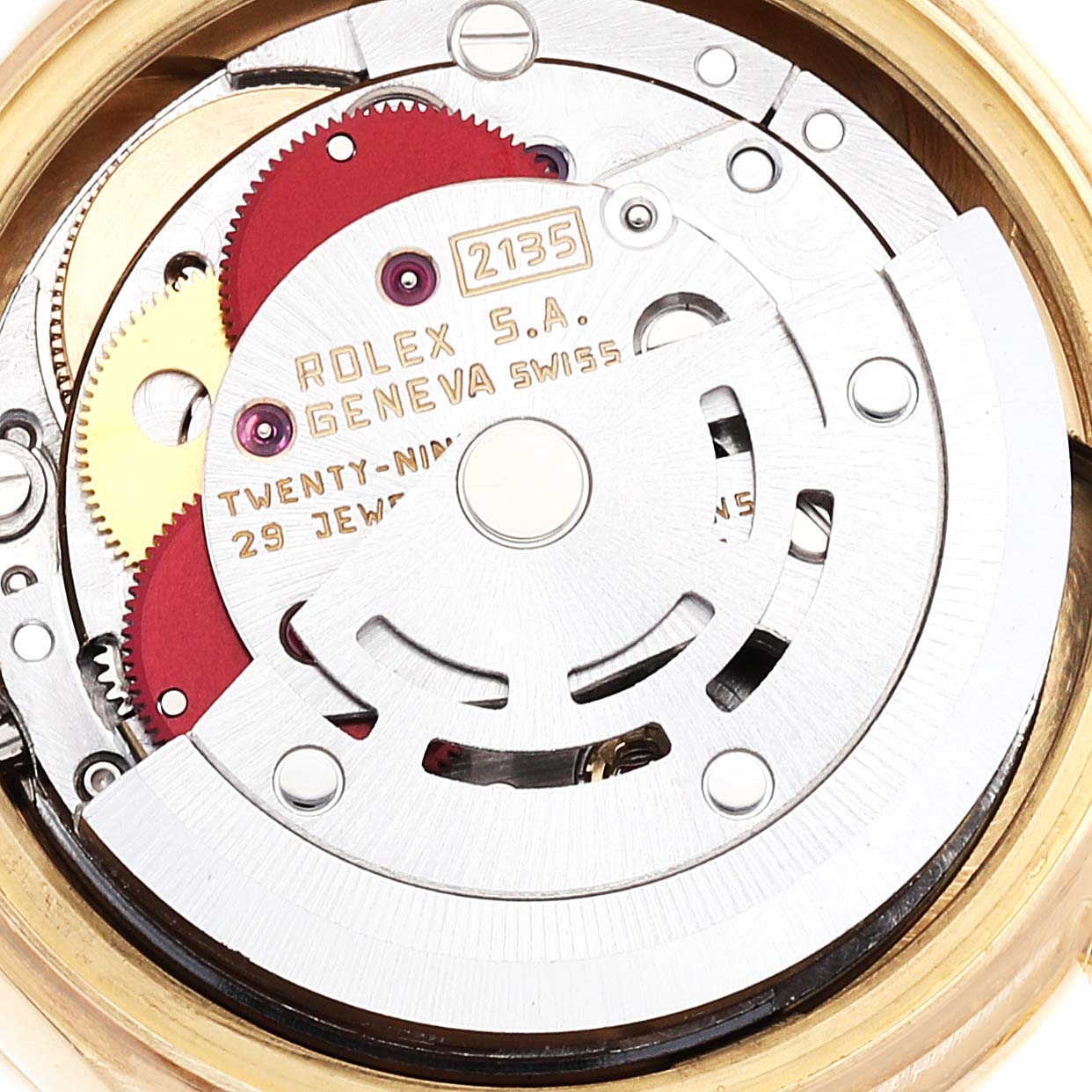 The image shows the internal mechanism of the Rolex President 69138 Women
s Yellow Gold Champagne Dial 69138 Women
s Yellow Gold Champagne Dial model, highlighting the gears and movement components.