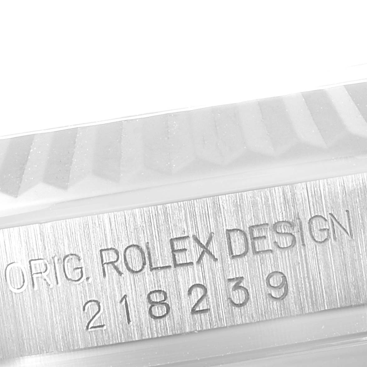The image shows a close-up of the watch bezel and case with engraved text on a Rolex President 218239 Men's White Gold Blue Dial 218239 Men's White Gold Blue Dial model.