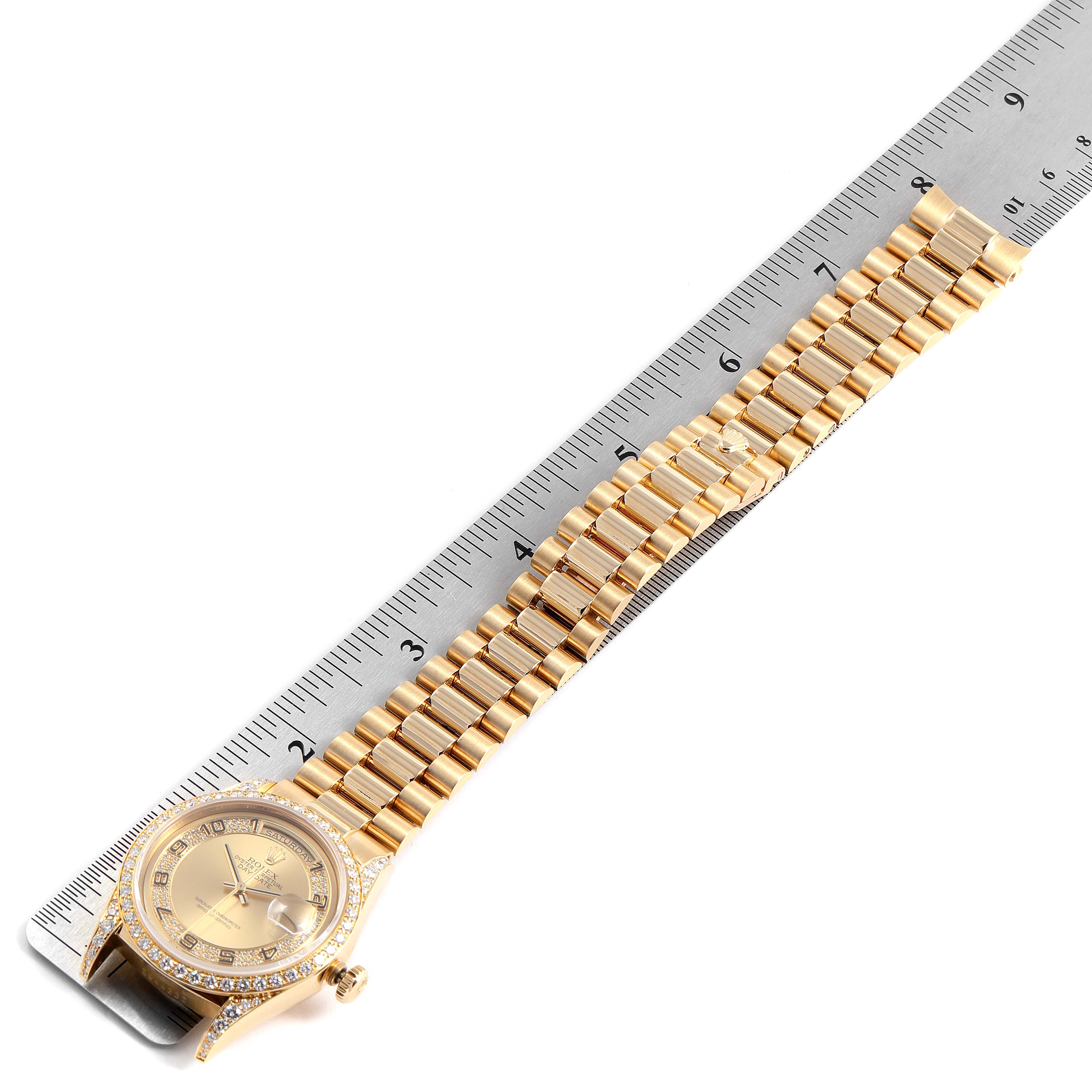 The Rolex President 18388 Men's Yellow Gold Champagne Dial 18388 Men's Yellow Gold Champagne Dial watch is shown flat with the face and full bracelet visible next to a ruler for scale.