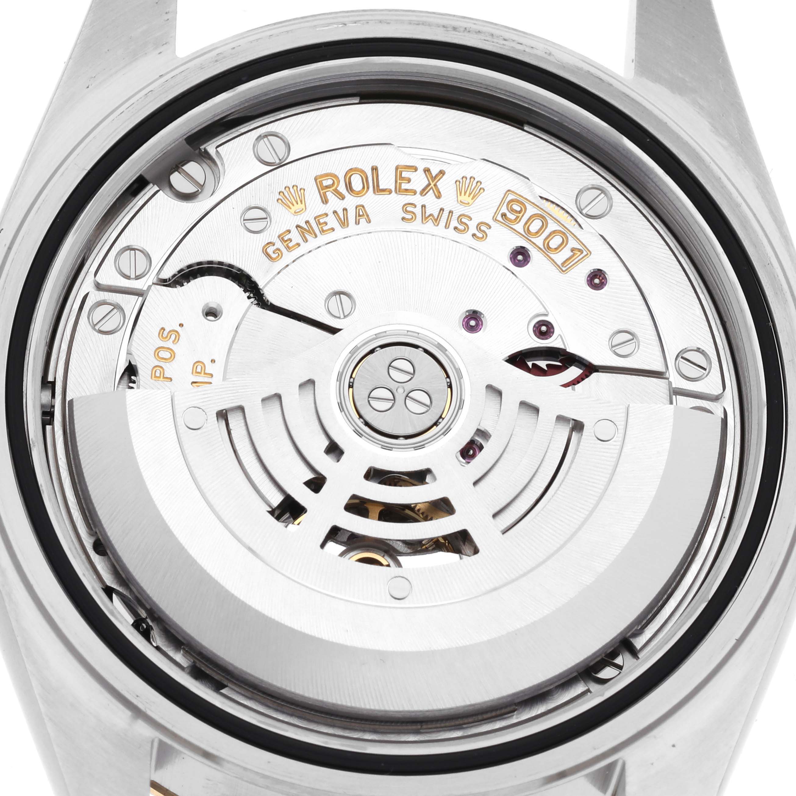 The image shows the back view of a Rolex Sky-Dweller 326933 Men's Steel and Gold (two tone) White Dial 326933 Men's Steel and Gold (two tone) White Dial, highlighting its intricate movement mechanism.