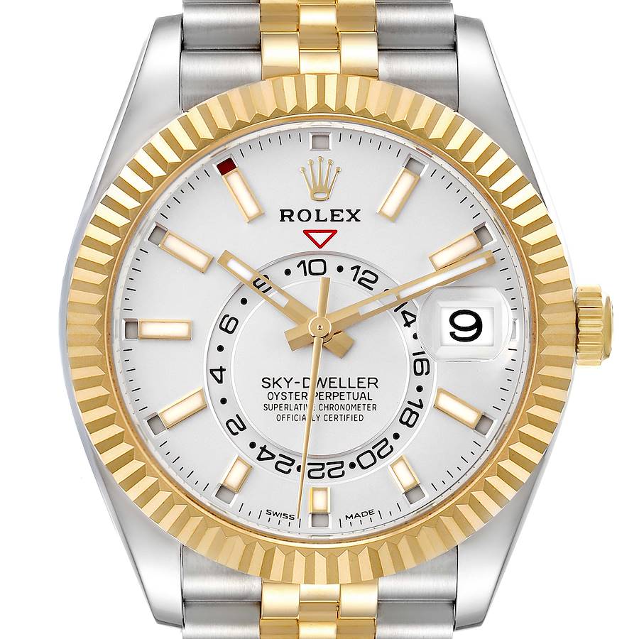 The Rolex Sky-Dweller watch is shown from a top view, displaying its face, bezel, and part of the bracelet.