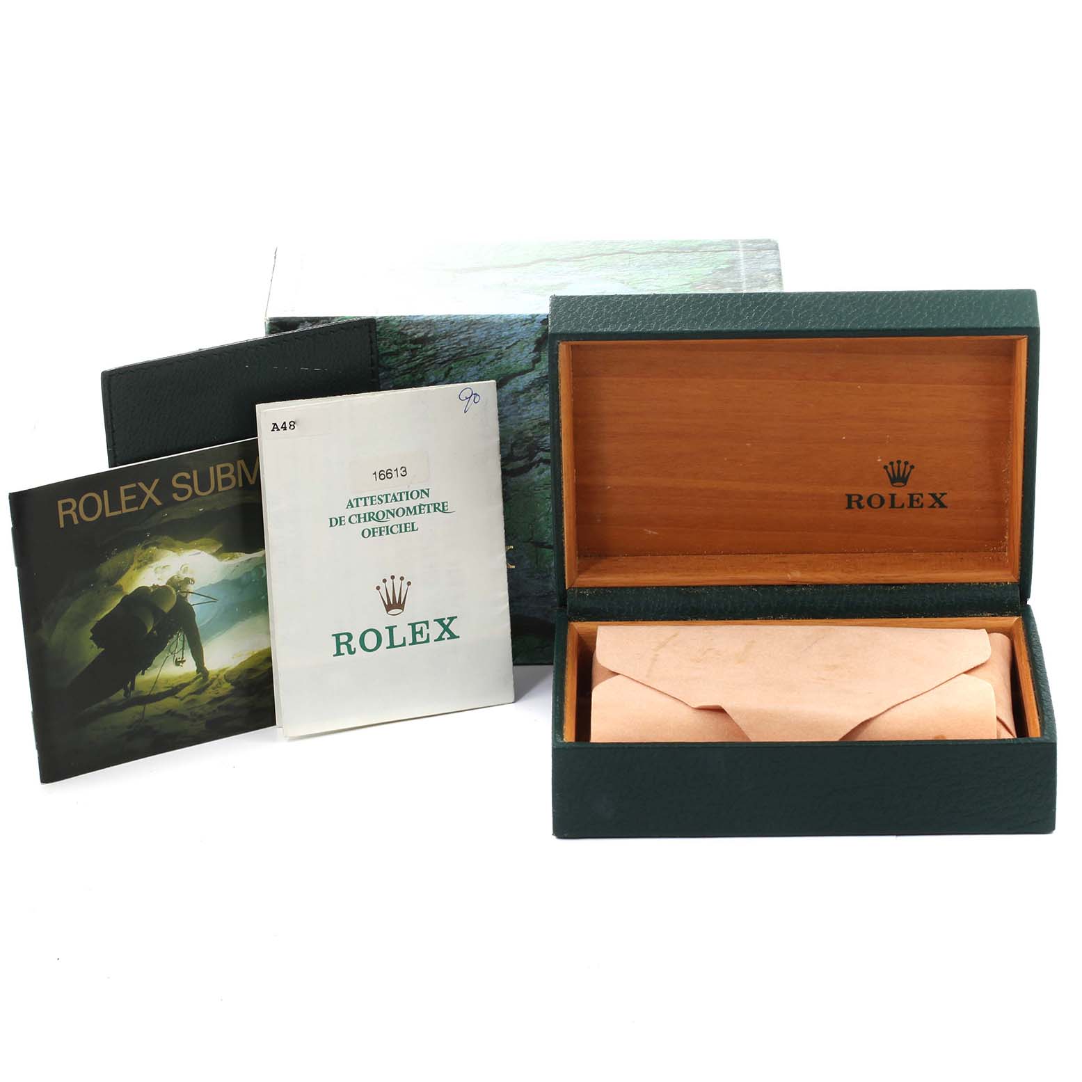 The image shows a green Rolex Submariner 16613 Men's Steel and Gold (two tone) Blue Dial 16613 Men's Steel and Gold (two tone) Blue Dial box, open to reveal the interior, along with accompanying booklets and paperwork.