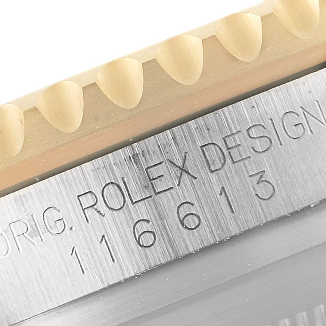 This close-up image shows the bezel and the engraved reference number of a Rolex Submariner 116613 Men
s Steel and Gold (two tone) Blue Dial 116613 Men
s Steel and Gold (two tone) Blue Dial watch.