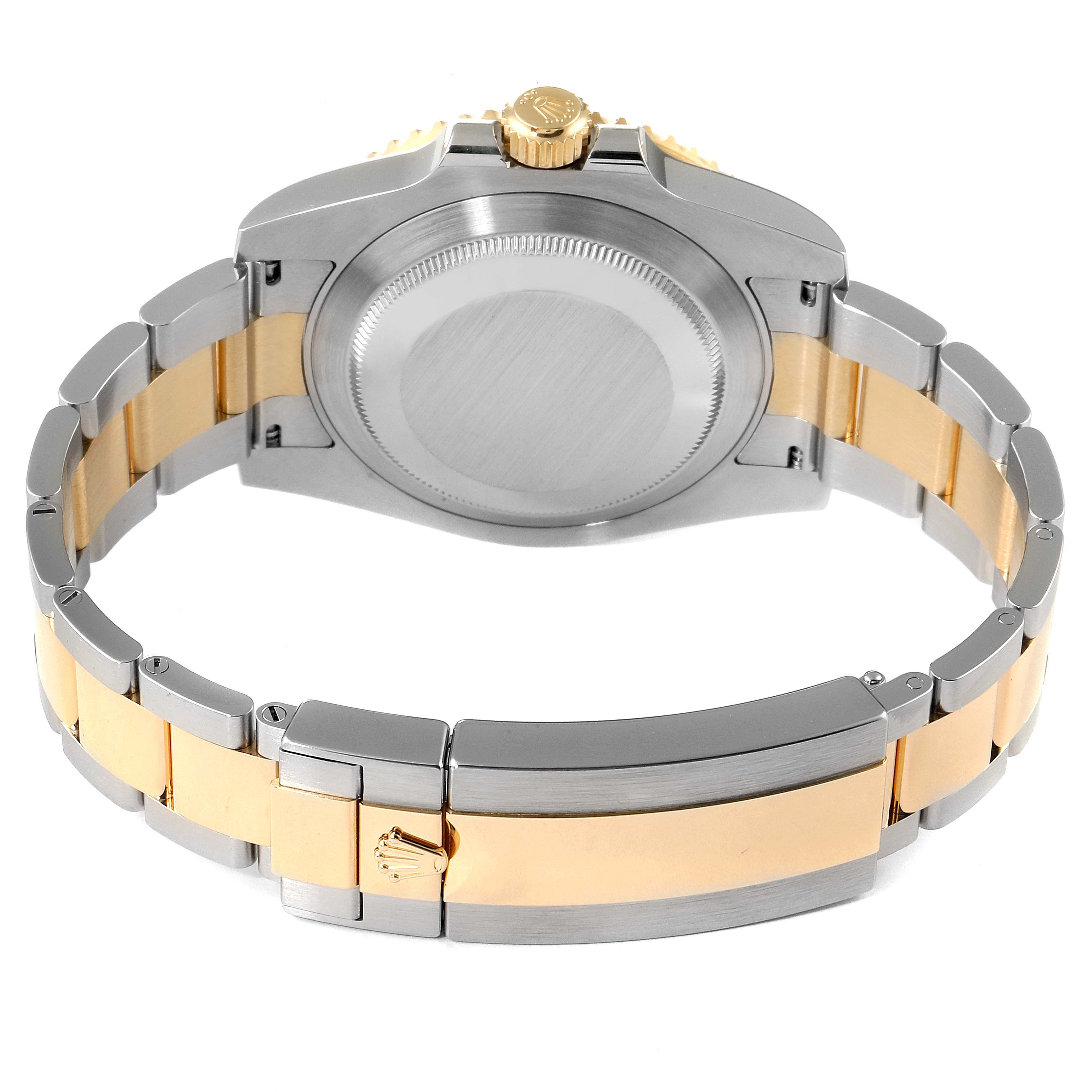 This is a rear view of a Rolex Submariner 116613 Men
s Steel and Gold (two tone) Blue Dial 116613 Men
s Steel and Gold (two tone) Blue Dial, showcasing its case back and bracelet.