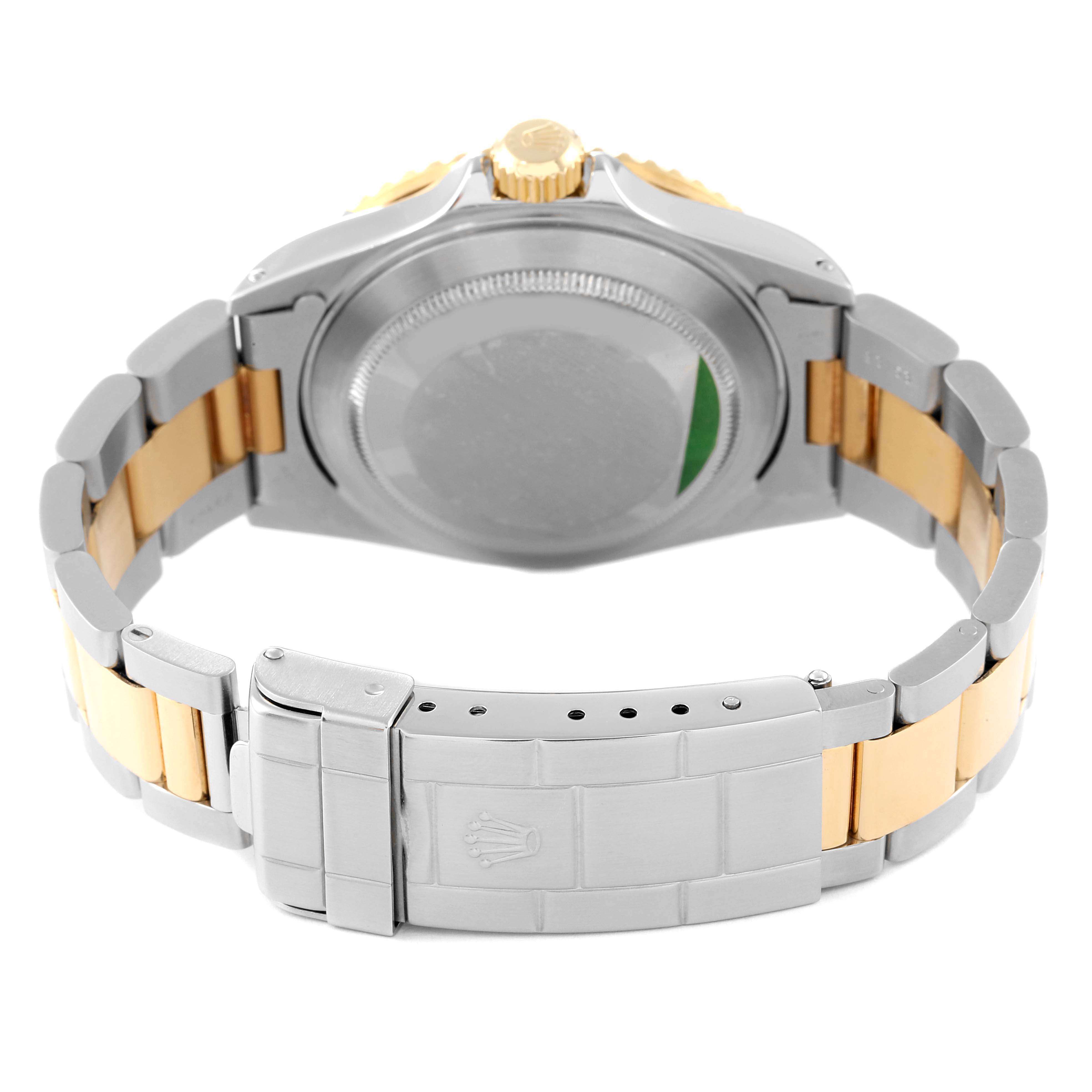 The image shows the back case and the clasp of a Rolex Submariner 16613 Men's Steel and Gold (two tone) Black Dial 16613 Men's Steel and Gold (two tone) Black Dial watch.