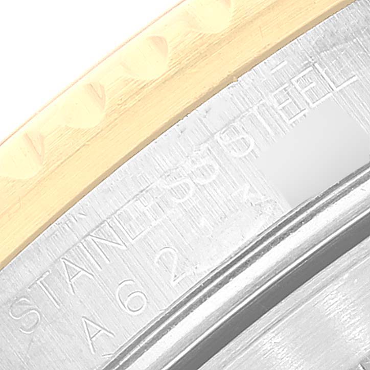 This close-up shows the stainless steel case and part of the bezel of a Rolex Submariner 16613 Men's Steel and Gold (two tone) Black Dial 16613 Men's Steel and Gold (two tone) Black Dial watch.