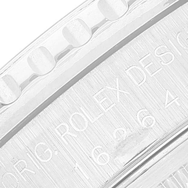 This close-up image shows the engraved writing on the bezel and case edge of a Rolex Turn-o-Graph 16264 Men
s Stainless Steel Black Dial 16264 Men
s Stainless Steel Black Dial watch.