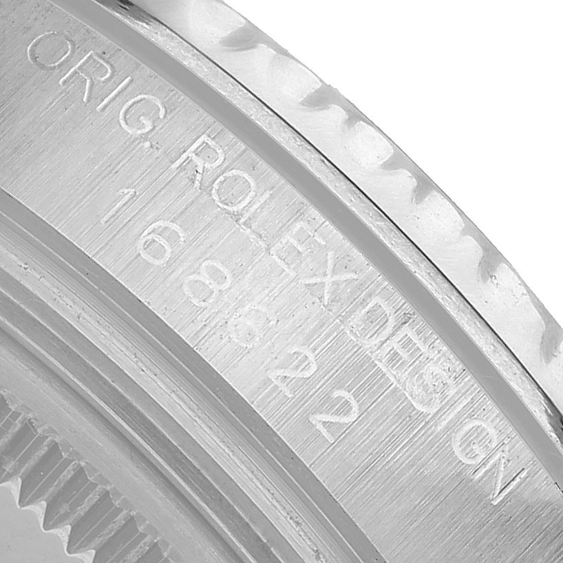 The image shows a close-up of the engraved edge of the Rolex Yacht-Master 168622 Men's Stainless Steel Silver Dial watch case.