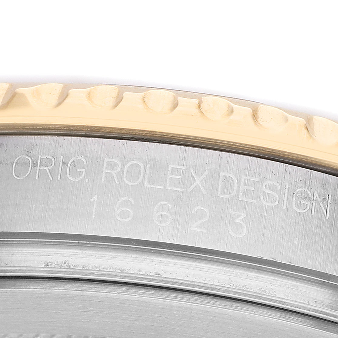 The image shows a close-up of the side of a Rolex Yacht-Master 16623 Men's Stainless Steel Champagne Dial watch, highlighting the bezel and engraved model number.