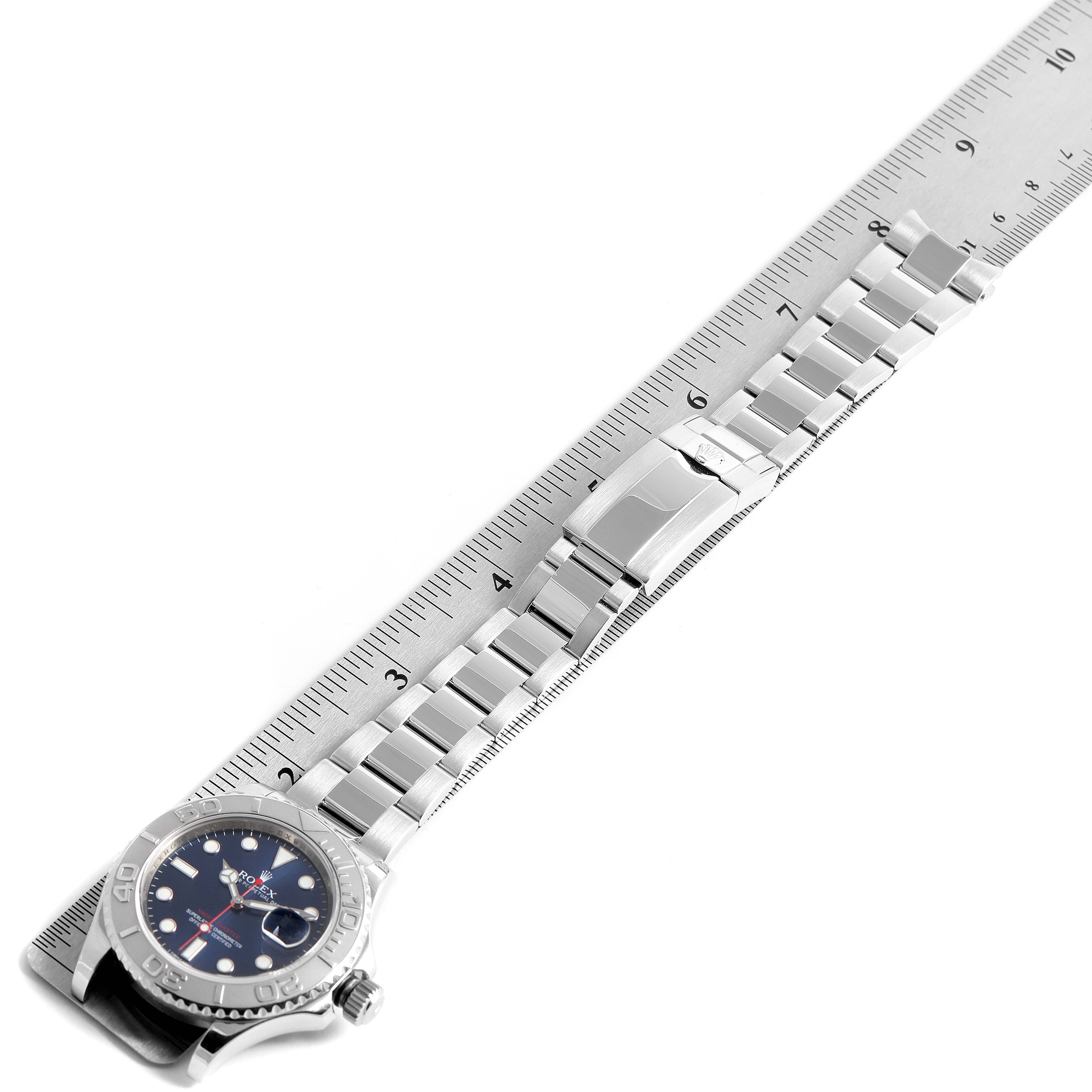 This top-down image shows the Rolex Yacht-Master 116622 Men
s Stainless Steel Blue Dial 116622 Men
s Stainless Steel Blue Dial watch, including the dial, bezel, and full metal bracelet, measured with a ruler.