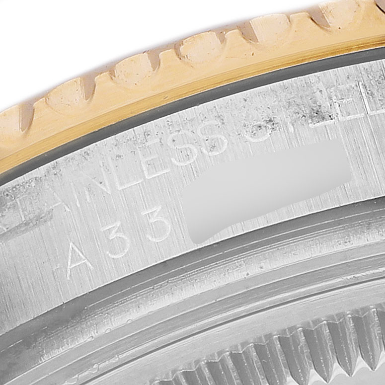 The image shows a close-up of the Rolex Yacht-Master 68623 Men's Steel and Gold (two tone) Blue Dial watch's bezel and part of the case, highlighting its engraving details.