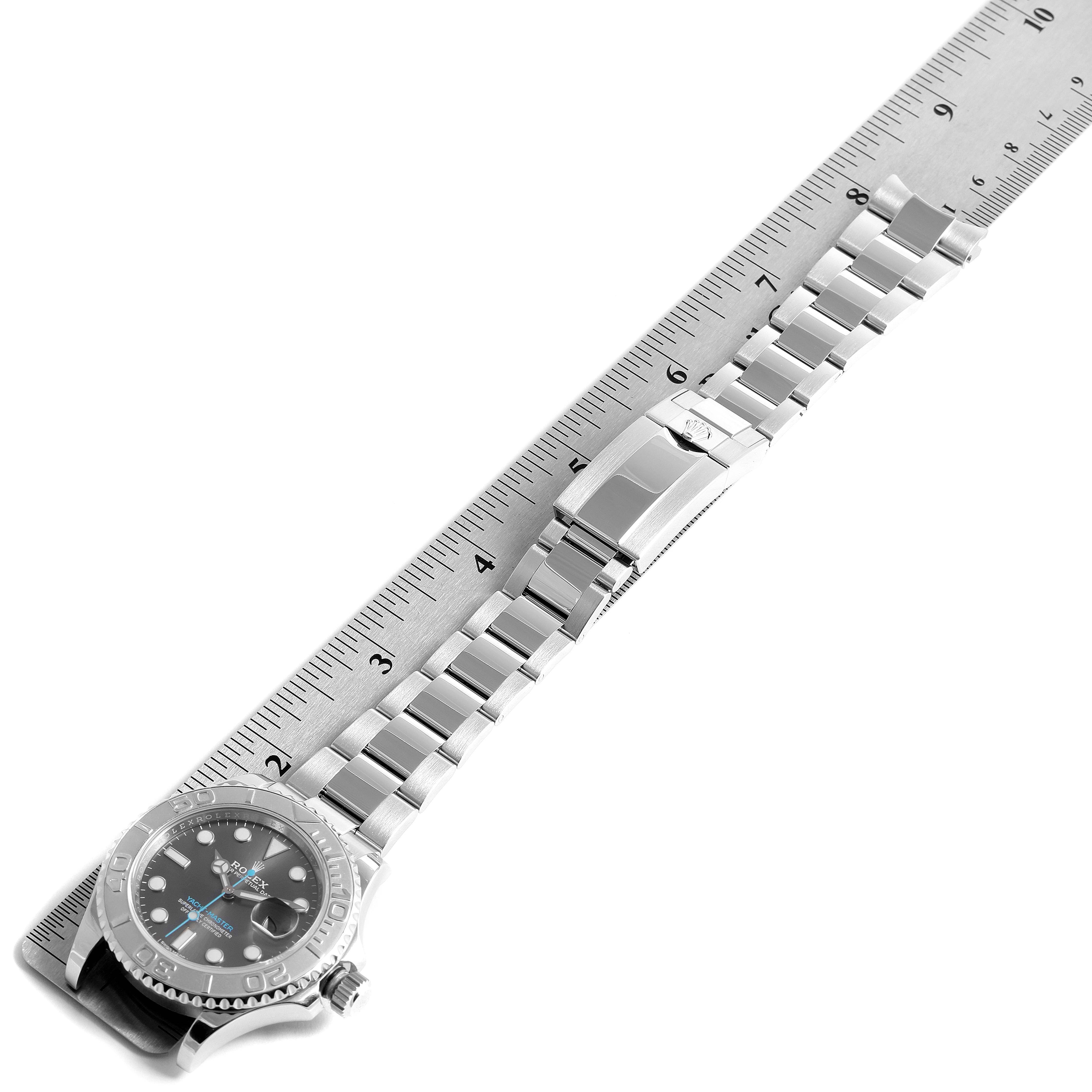 The Rolex Yacht-Master 116622 Men's Stainless Steel Grey Dial 116622 Men's Stainless Steel Grey Dial watch is shown from a slight angle with its bracelet fully extended along a ruler.