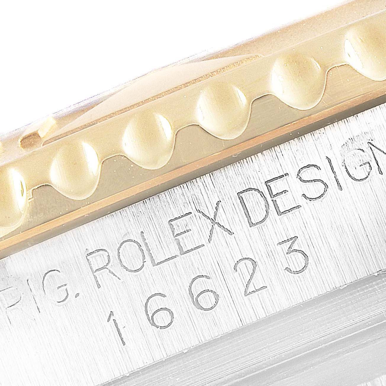 The image shows a close-up of the bezel and part of the case of a Rolex Yacht-Master 16623 Men's Stainless Steel White Dial 16623 Men's Stainless Steel White Dial watch.