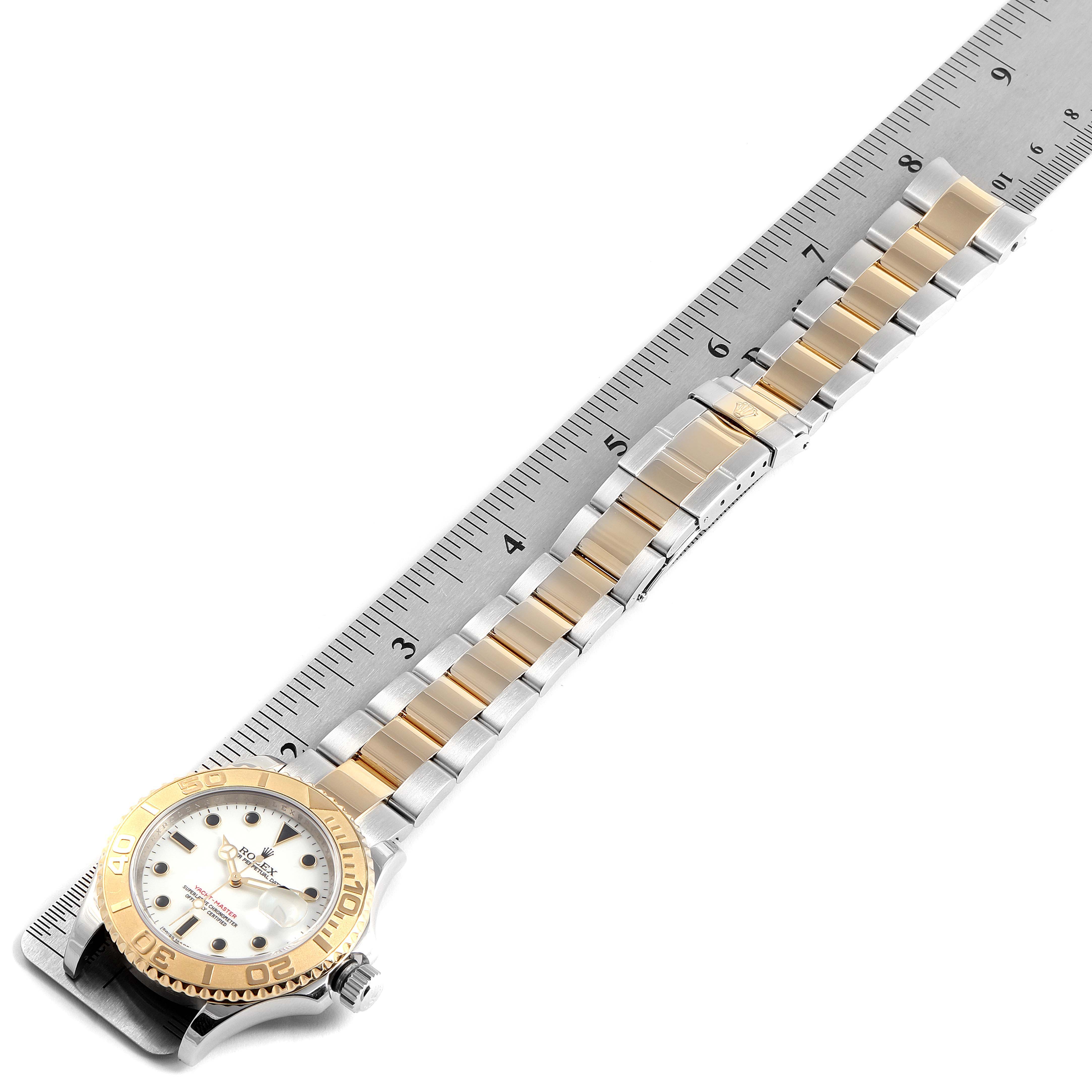 The image shows a top-down angle of the Rolex Yacht-Master 16623 Men's Stainless Steel White Dial 16623 Men's Stainless Steel White Dial watch, displaying its face and bracelet alongside a ruler for scale.