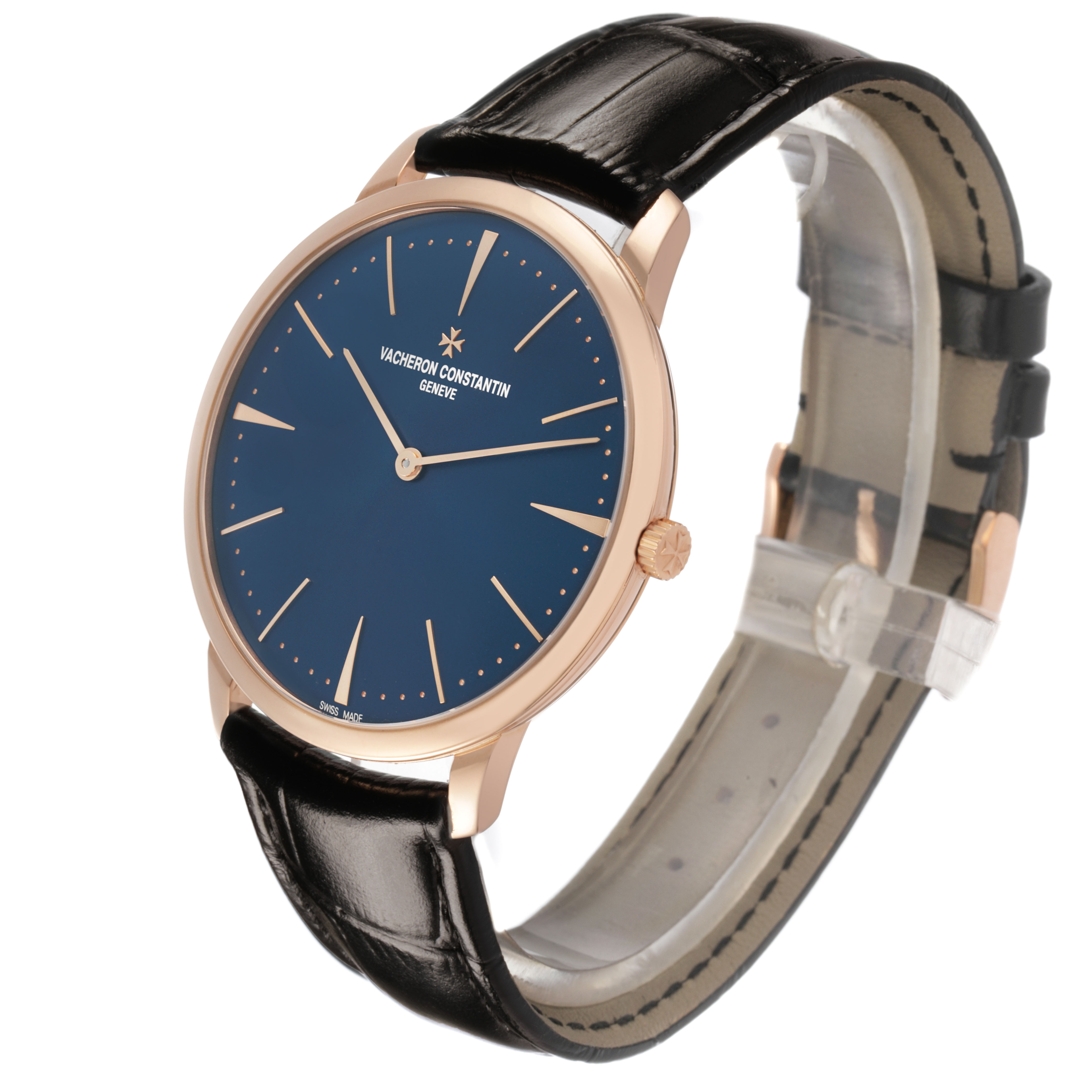 The Patrimony by Vacheron Constantin is shown at an angled side view, highlighting the face, rose gold case, crown, and black leather strap.